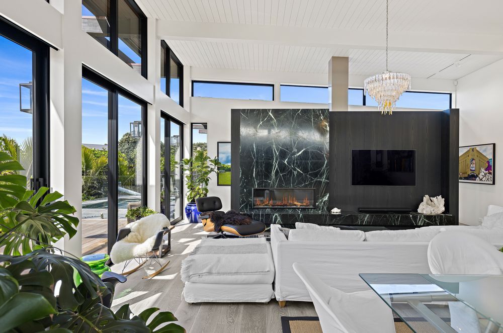 Stunning Viridian Green Marble surrounds the Escea DSC400 Fireplace.
