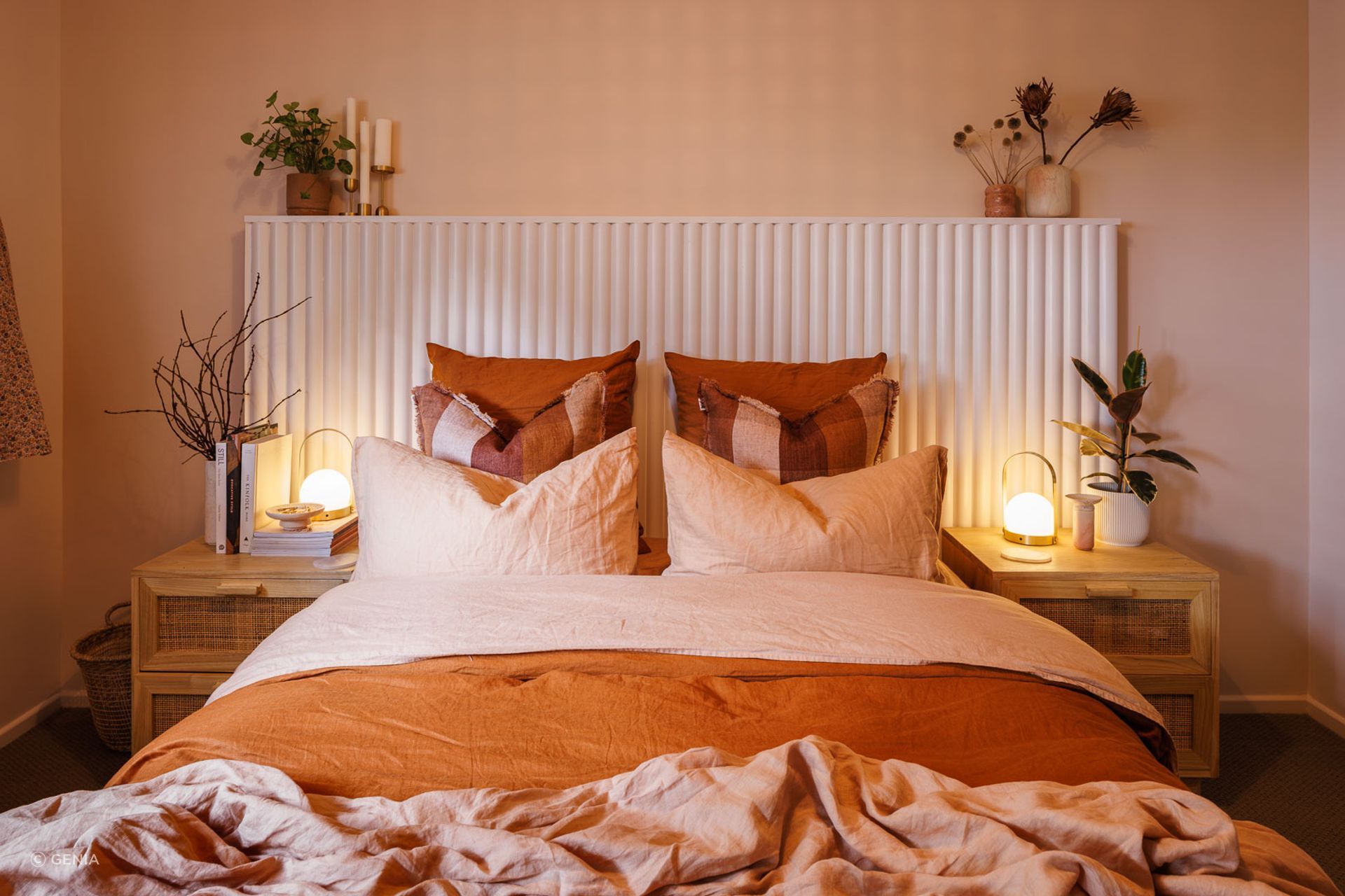 A few select plants really elevate this space alongside the exquisite Maiko profile headboard. | Photographer: Andre Vroon