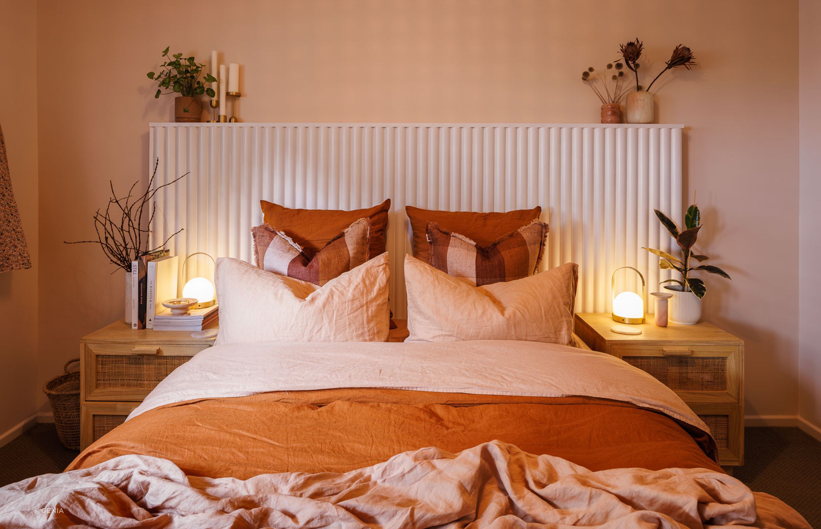 A few select plants really elevate this space alongside the exquisite Maiko profile headboard. | Photographer: Andre Vroon