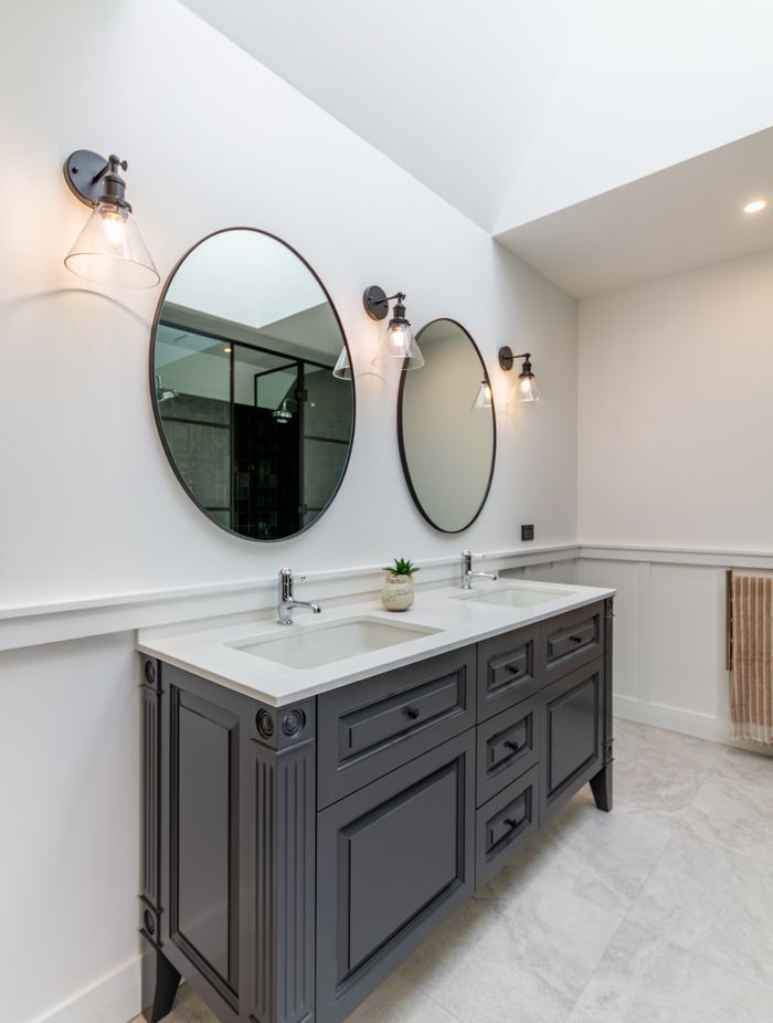 Skylights let light into the master en suite. The character detailing is also extended into the bathroom spaces.