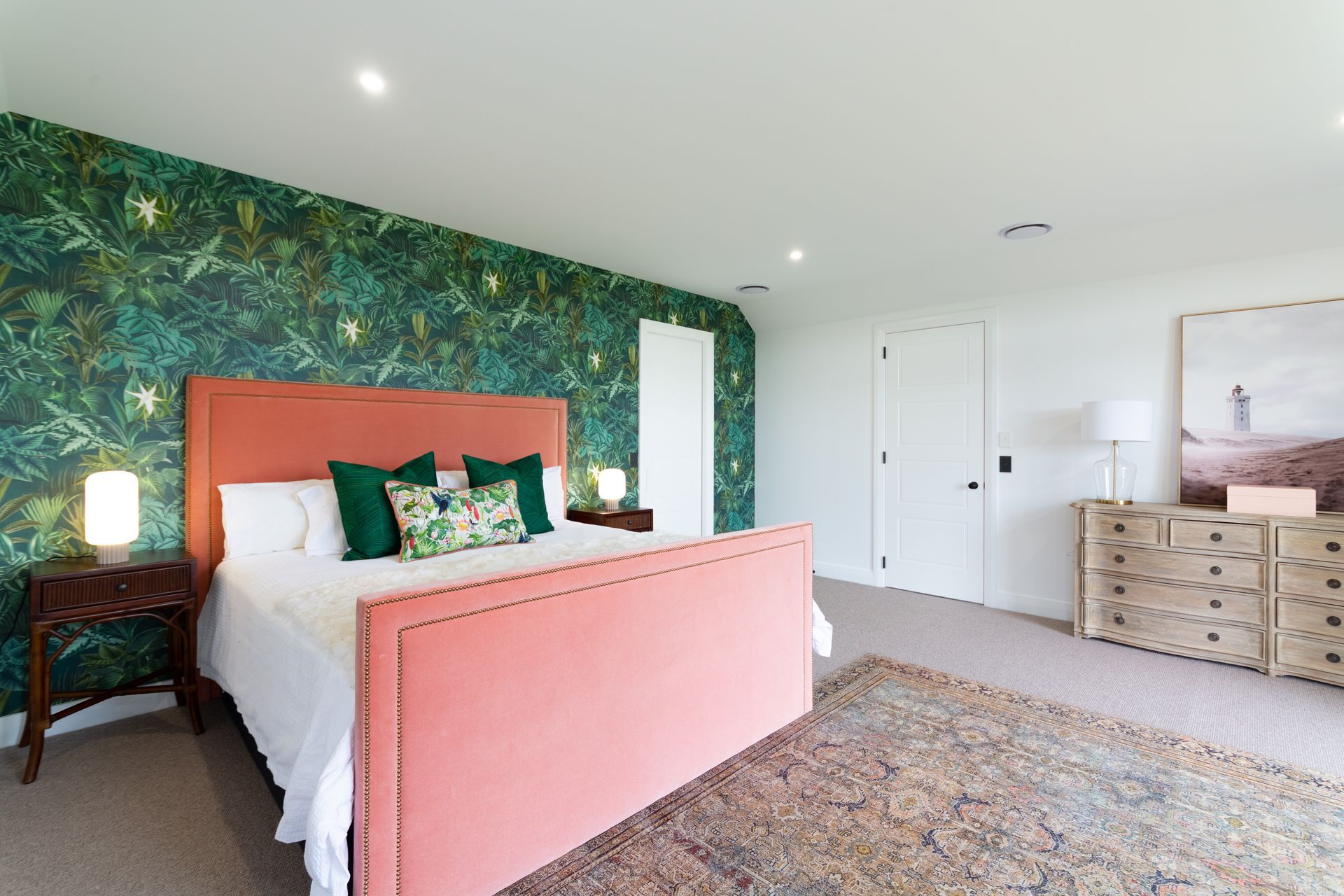 The master bedroom is spacious and opens out onto a private balcony that sits above the downstairs living space.