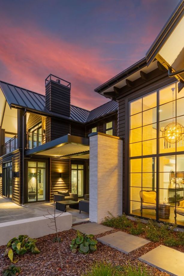 In this image you can see the interaction of all of the different building elements, from the foyer's double-height glazing, to the louvred outdoor courtyard and the gabled roofs with corbel details under the soffits.
