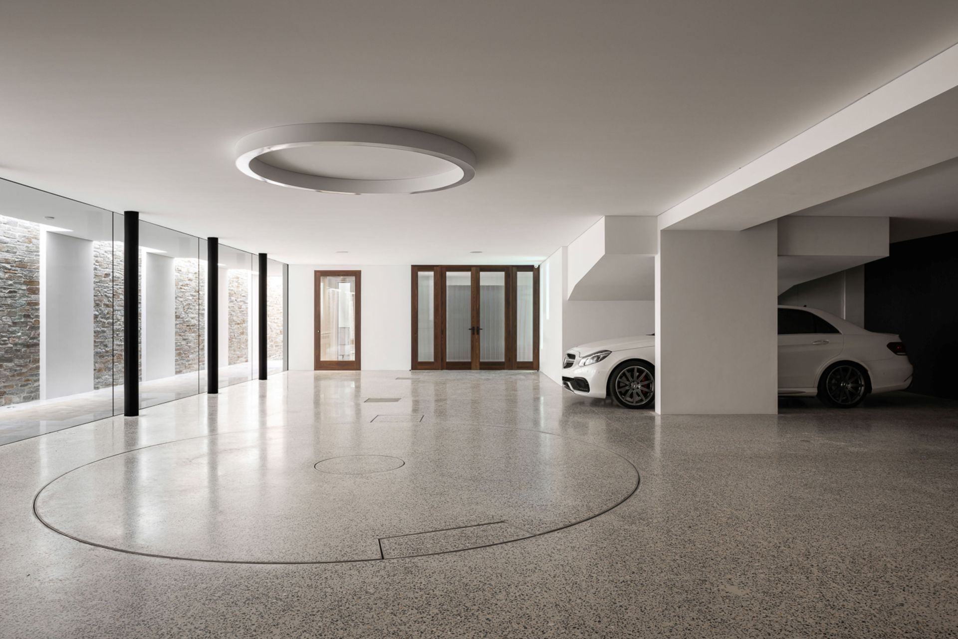 No expense was spared in the six-car garage with turn table for easy maneuvering.