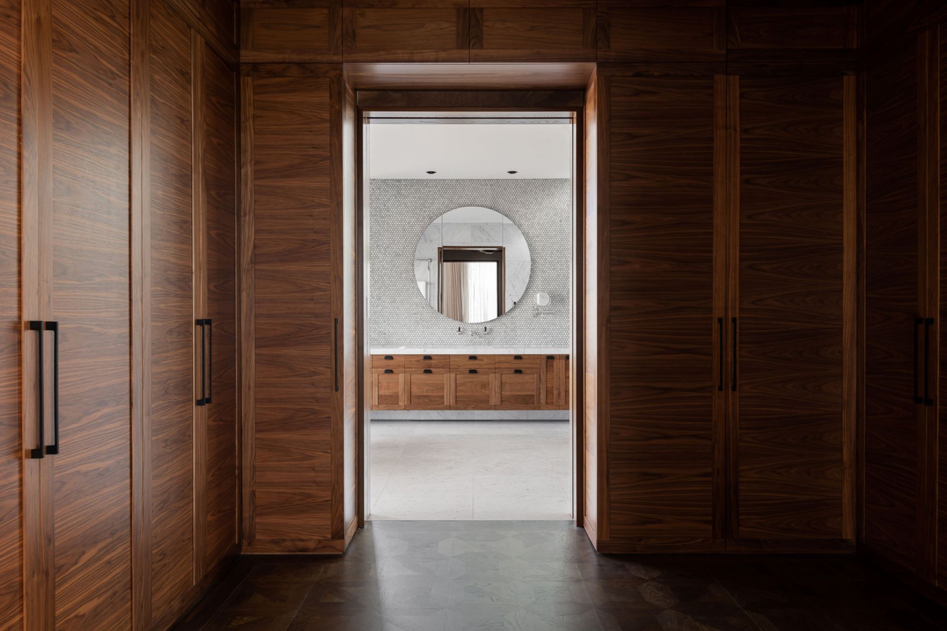 Solid walnut cabinetry and panelling features throughout, cut from full pieces so that the grain continues fluidly from one piece to the next.