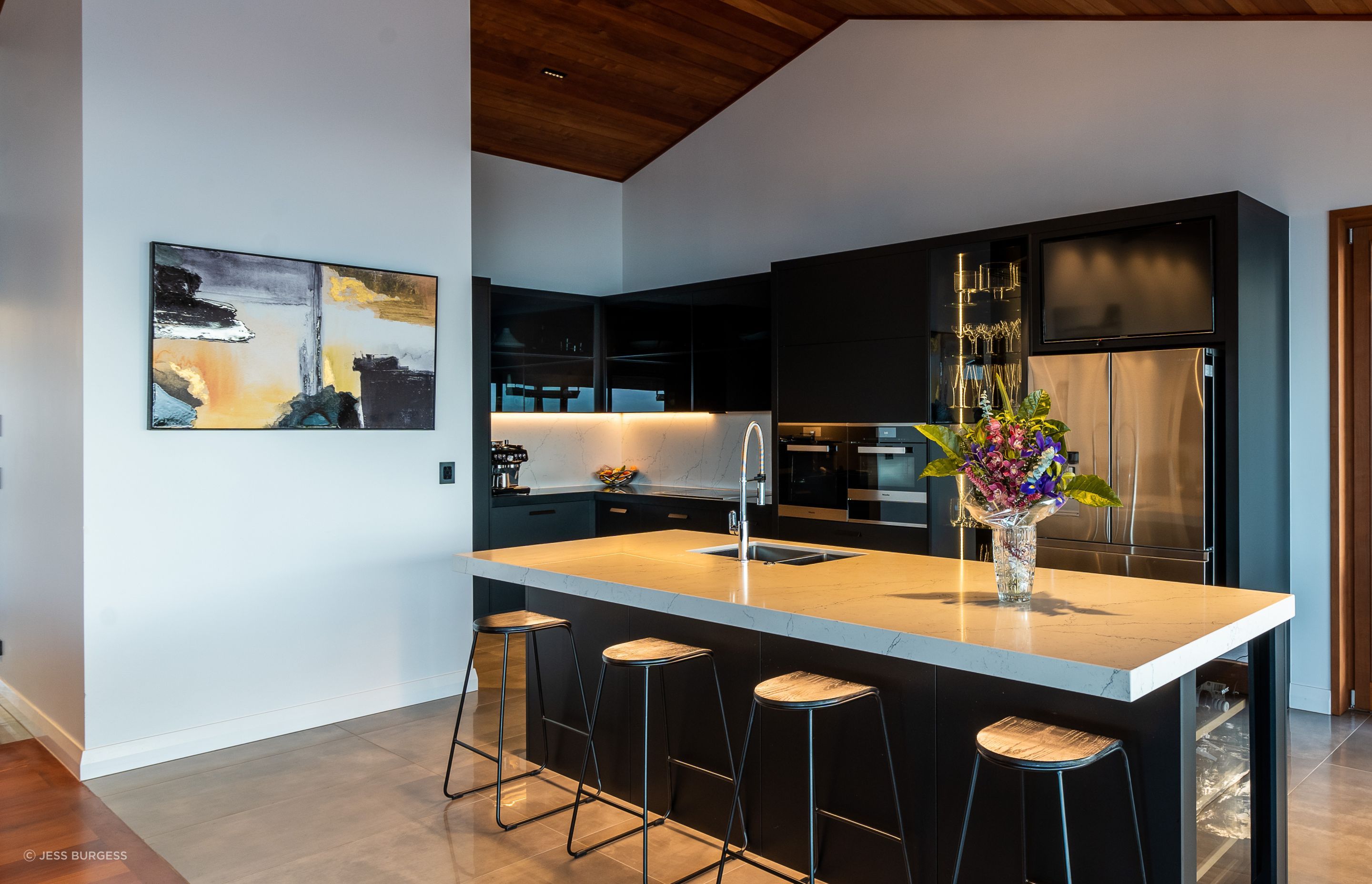 The ovens in the kitchen are by Miele and the fridge is by Samsung. With a glassware display cabinet, two dishwashers and a Vintec wine fridge, it's a house made for entertaining.