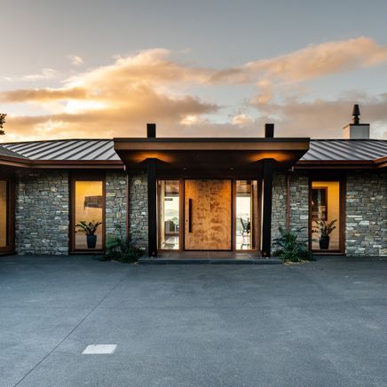 Refined industrial chic immersed in a Bay of Islands vista