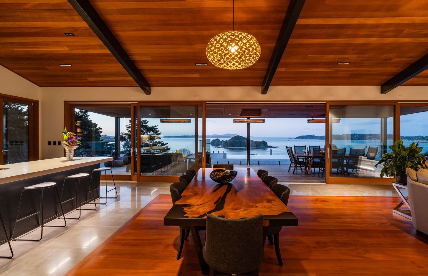 The wood for the inlay floor was sourced by the homeowner. The 13.5m doors were custom made by Optimal Windows. “They slide beautifully,” says Alan. On the ceiling are pinpoint Laser Blade downlights by iGuzzini that reduce glare.