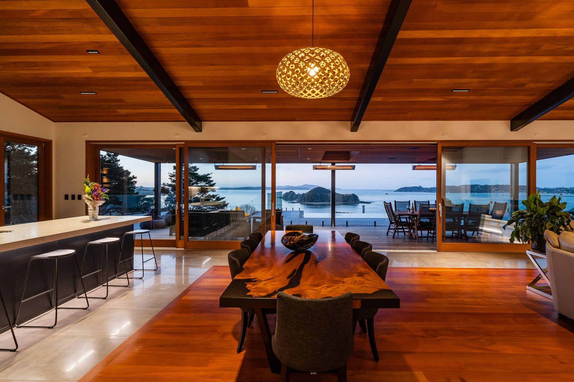 The wood for the inlay floor was sourced by the homeowner. The 13.5m doors were custom made by Optimal Windows. “They slide beautifully,” says Alan. On the ceiling are pinpoint Laser Blade downlights by iGuzzini that reduce glare.