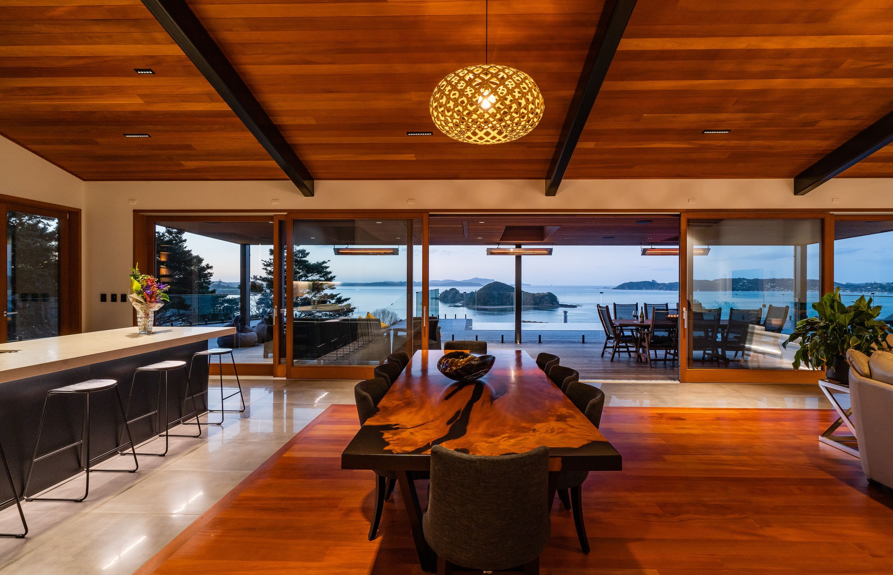 The wood for the inlay floor was sourced by the homeowner. The 13.5m doors were custom made by Optimal Windows. “They slide beautifully,” says Alan. On the ceiling are pinpoint Laser Blade downlights by iGuzzini that reduce glare.