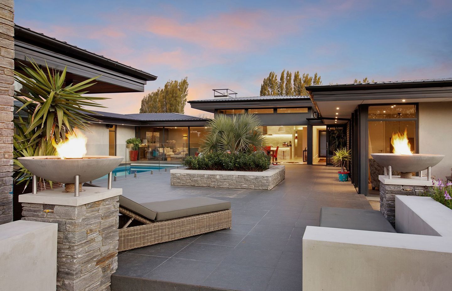 Schist stone has been used in a number of areas, complementing the neutral palette of the home.