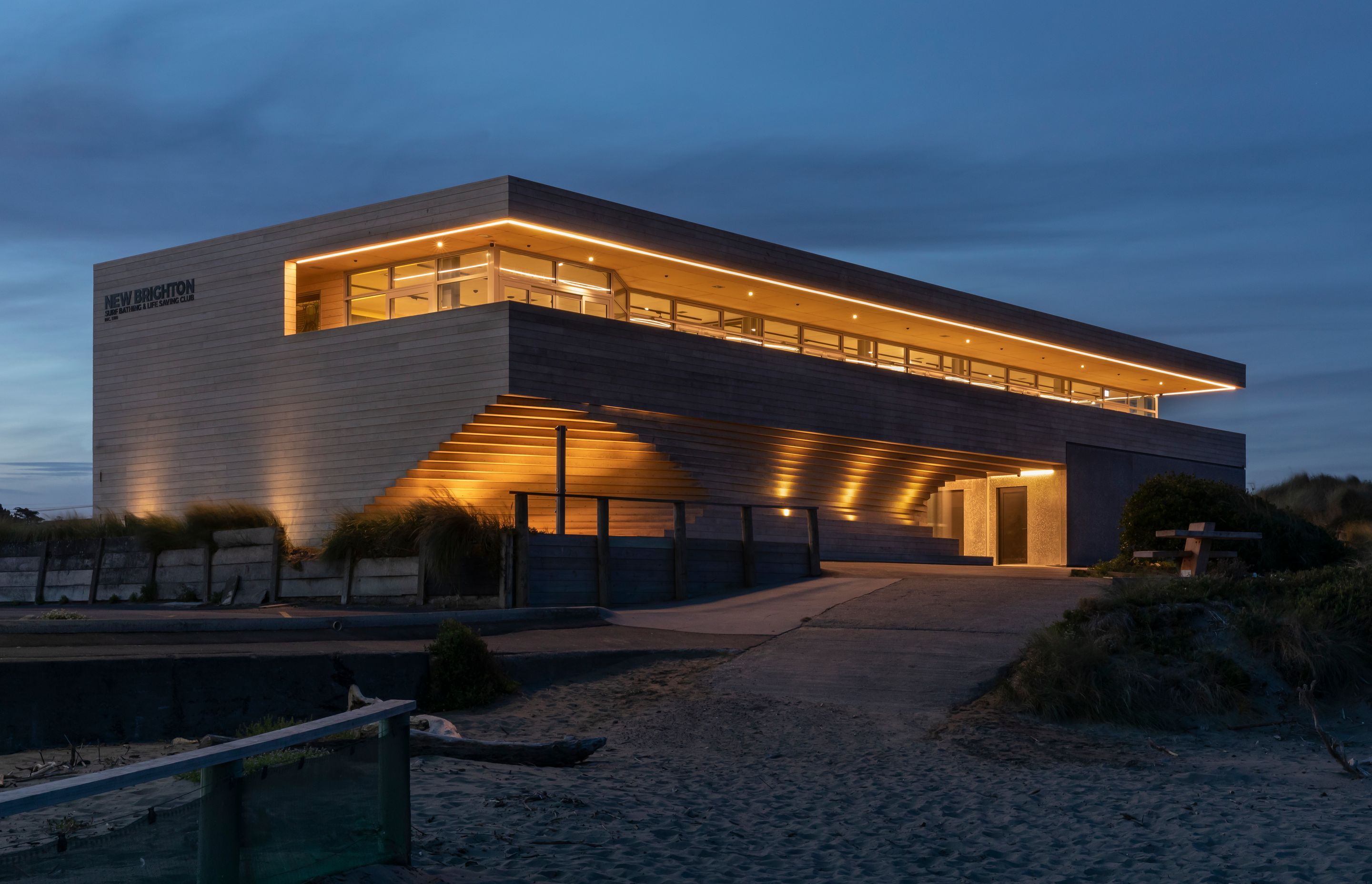 Up-lighting at night enhances the sculptural qualities of the building.