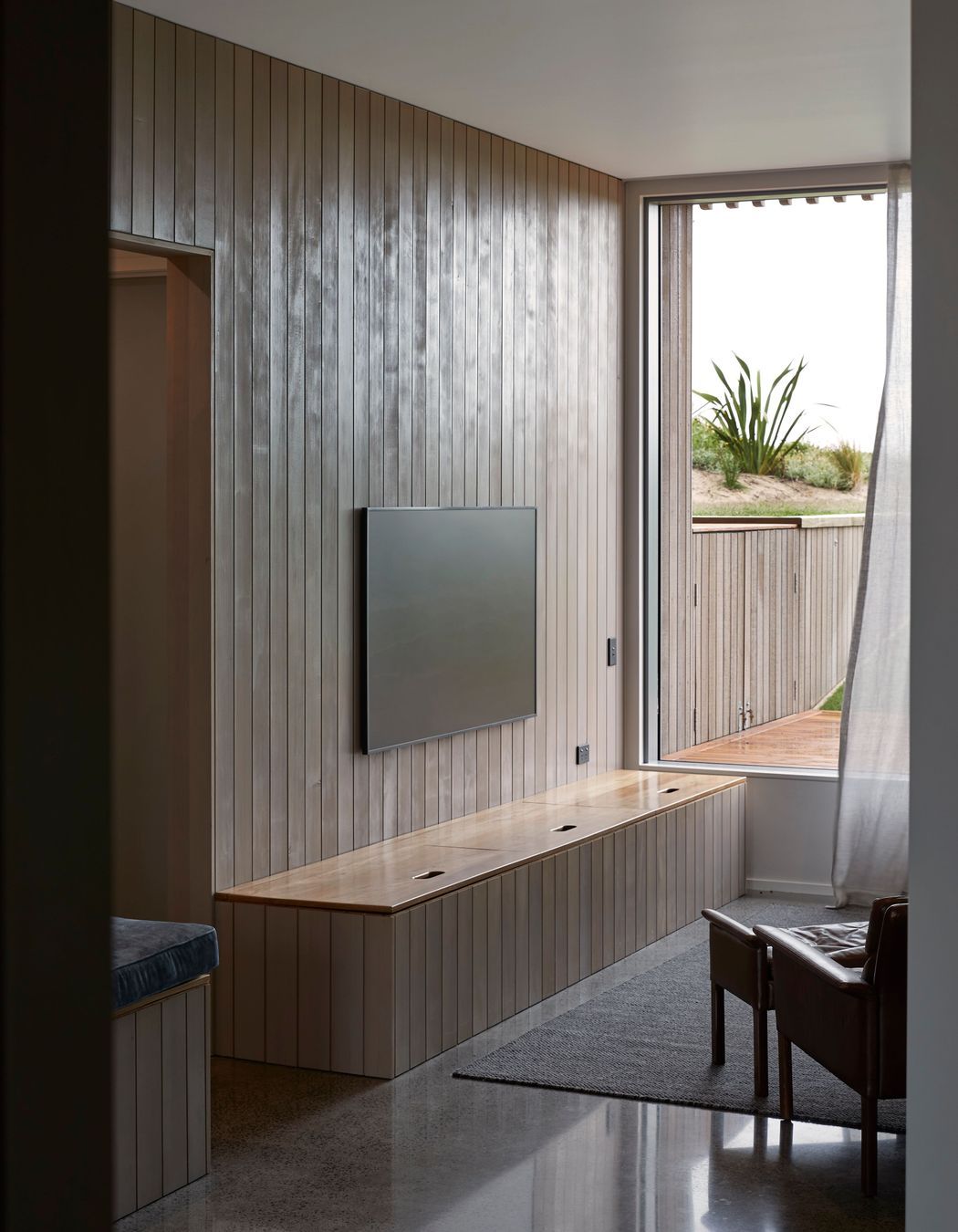 The ground floor's rumpus room, a relaxed space for the client's teens and/or visiting guests to enjoy. | Photographer: Jackie Meiring