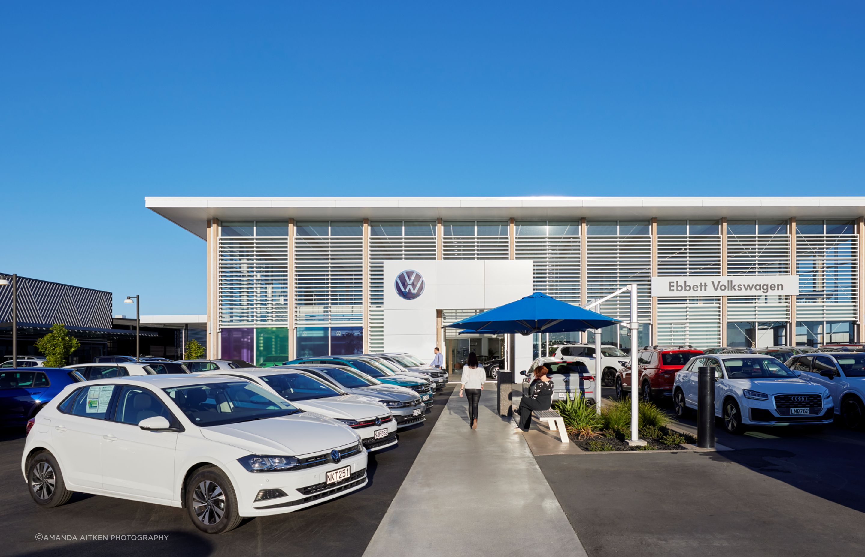 The Volkswagen dealership has a pale and Scandi-inspired design identity.