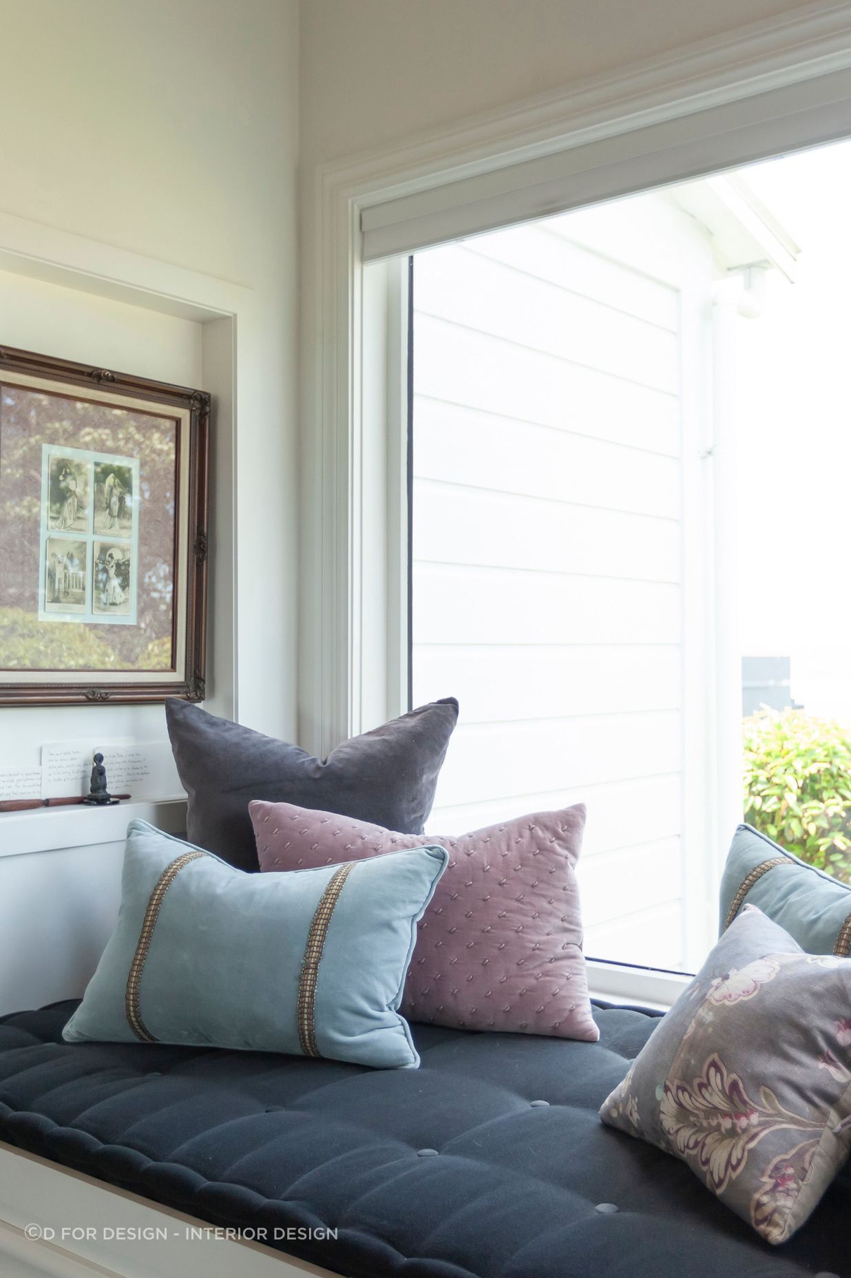 Aiken designed a window seat and a cavity in the bay window for artwork.