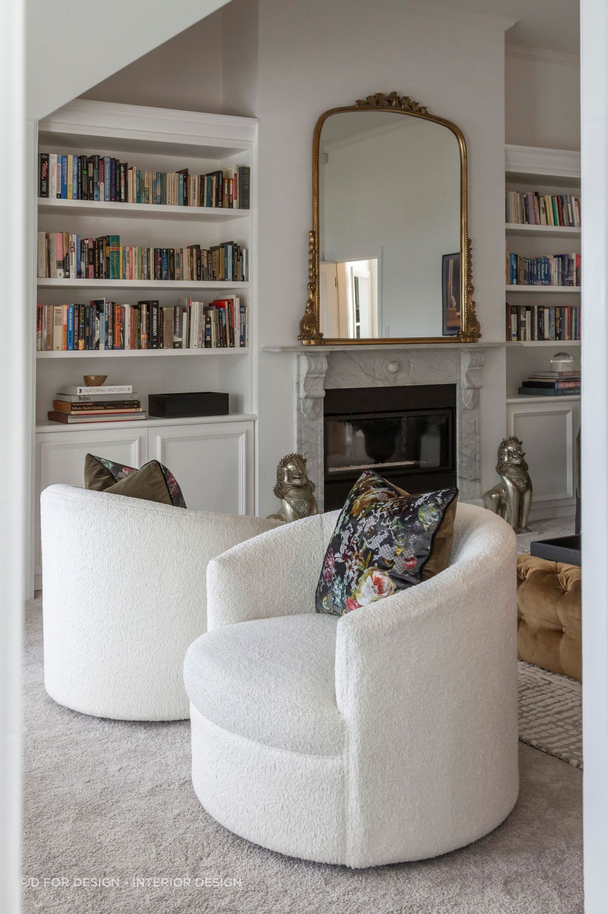Two beautiful bookcases were custom-designed and manufactured to fit the cavities
on either side of the fireplace – a nod to Parisian style.