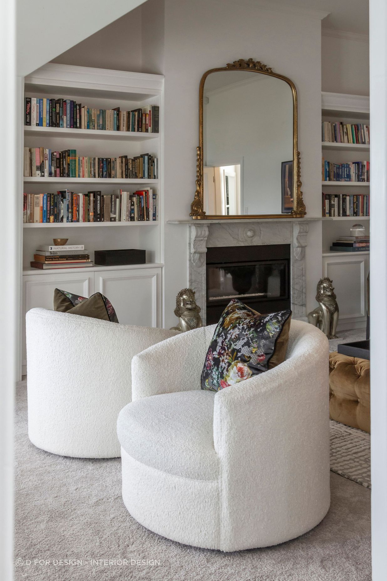 Two beautiful bookcases were custom-designed and manufactured to fit the cavities
on either side of the fireplace – a nod to Parisian style.