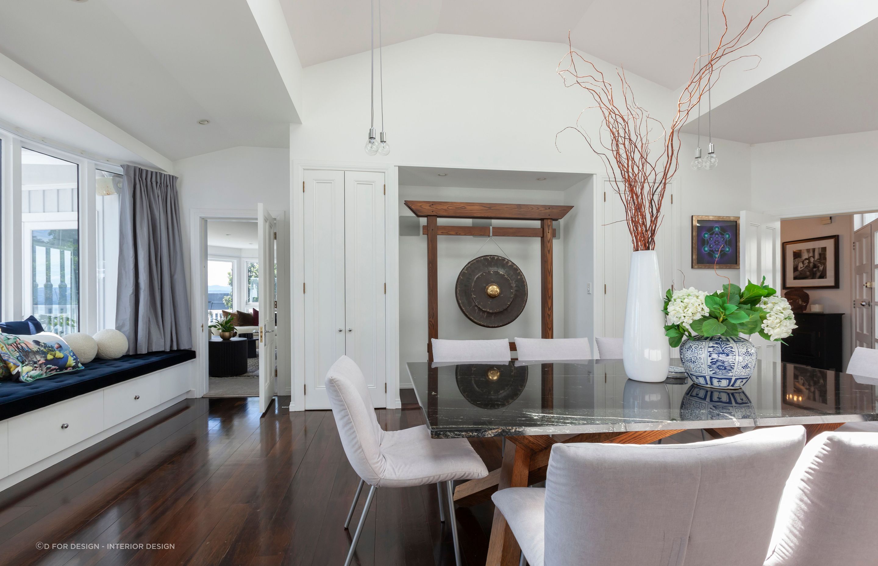 A ceremonial gong has been considerately included in the dining room with lighting above.