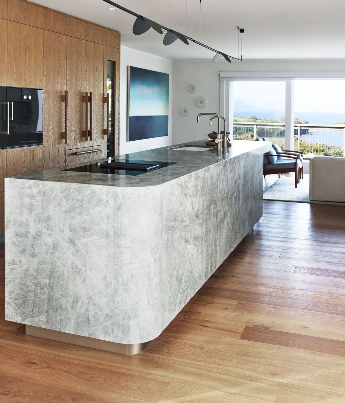 The view was the focus of the kitchen renovation. The light fixture was chosen as the cap details reminded Natalie of sea birds.