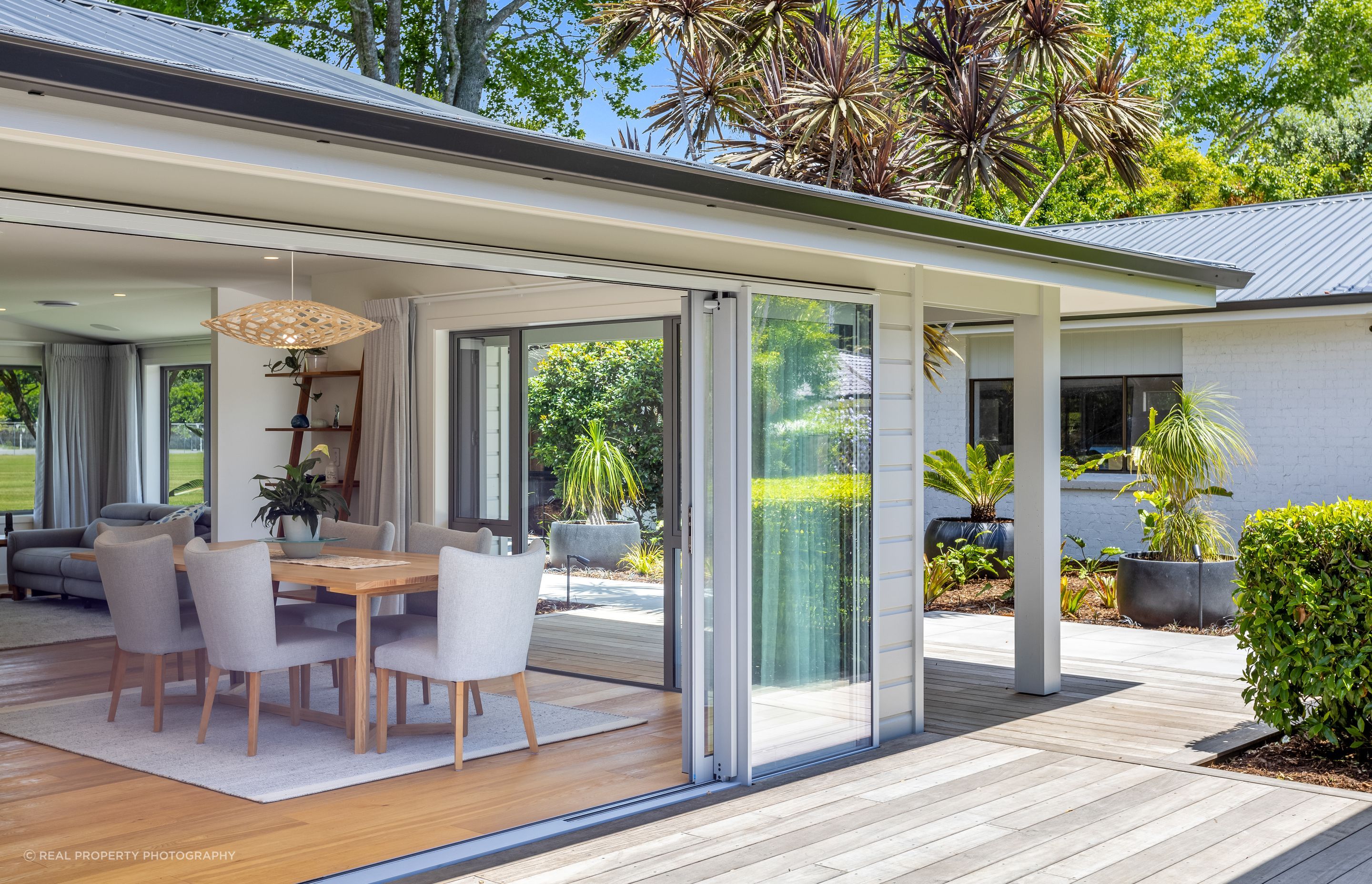 “We extended the main living area, adding two new structural portals to completely open up the living and kitchen space. New sliding doors were installed that lead out onto an ‘epic’ outdoor entertainment area, covered from the elements with louvres from LouvreSpan. This has essentially doubled the size of their living space!”