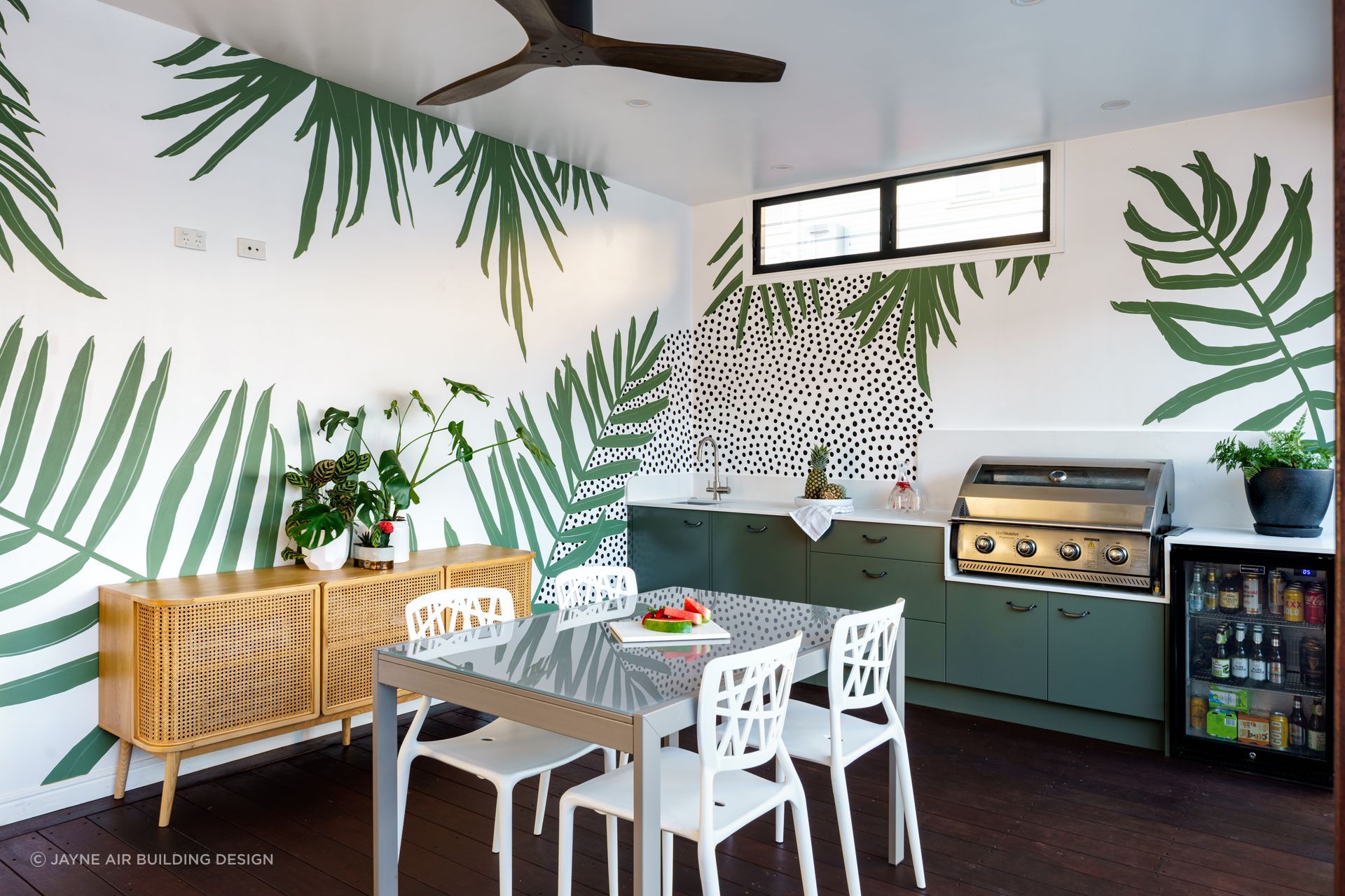 An outdoor sink, like the one featured in this exquisite Tarragindi outdoor kitchen, makes food preparation, cooking and cleaning so much easier