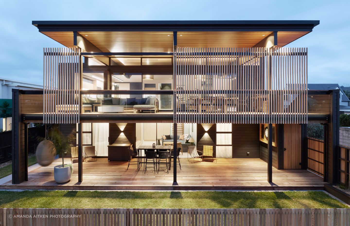 The elegant coastal holiday home in Whangamatā designed by Brendon Gordon of Brendon Gordon Architects captures the best of the views from any angle, and can accommodate the homeowners' multigenerational extended family.