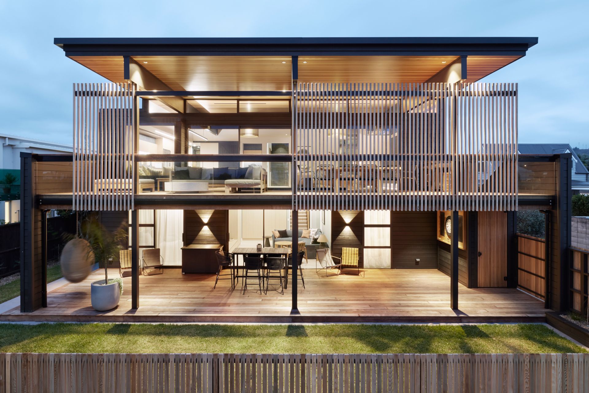 The elegant coastal holiday home in Whangamatā designed by Brendon Gordon of Brendon Gordon Architects captures the best of the views from any angle, and can accommodate the homeowners' multigenerational extended family.