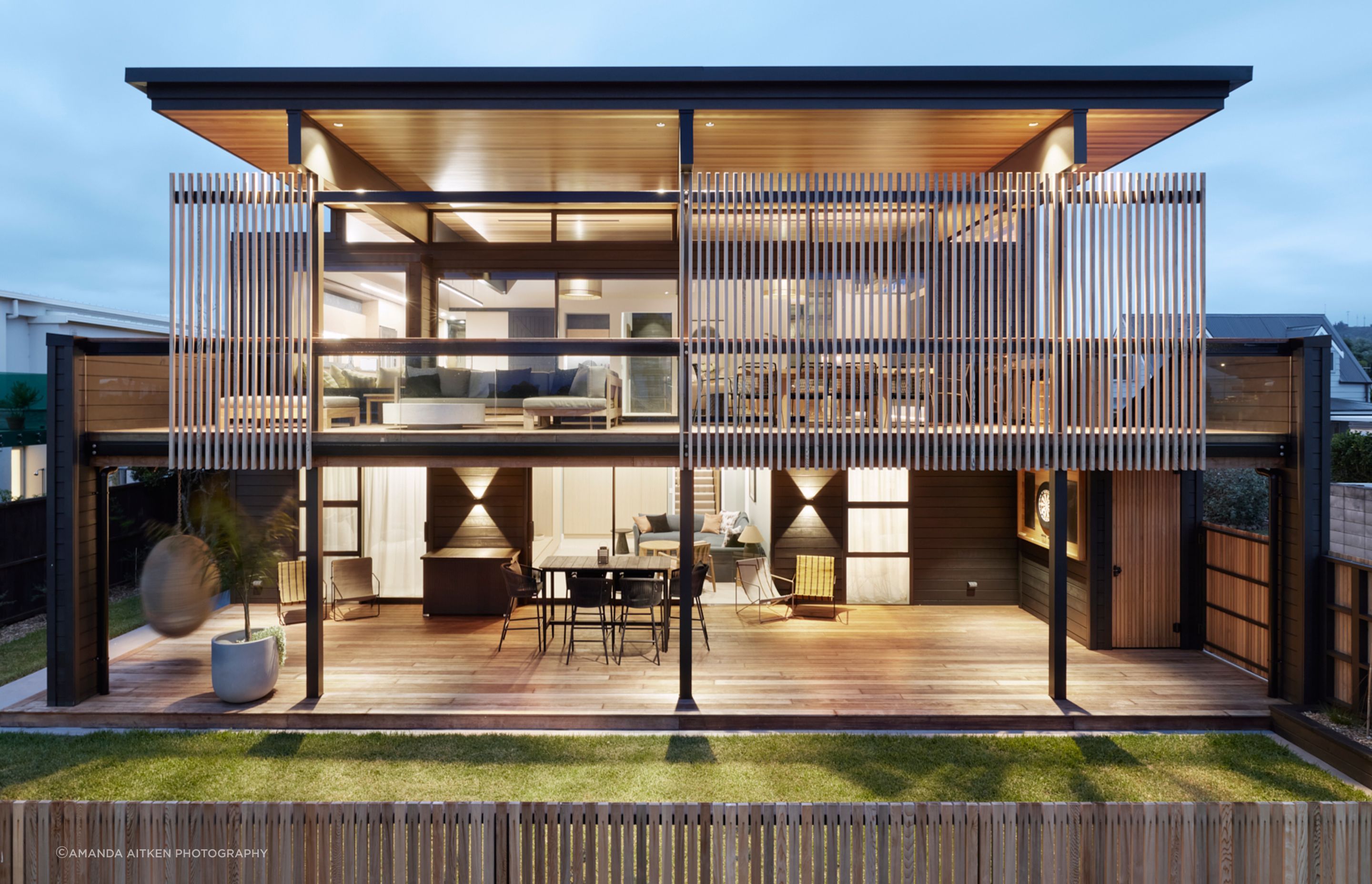 The elegant coastal holiday home in Whangamatā designed by Brendon Gordon of Brendon Gordon Architects captures the best of the views from any angle, and can accommodate the homeowners' multigenerational extended family.