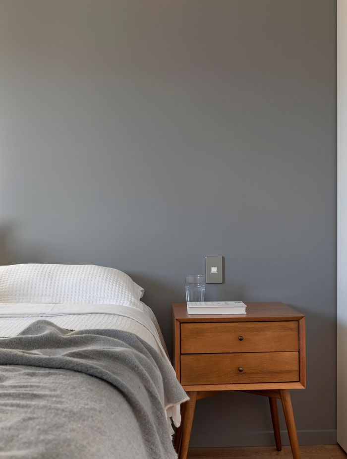 Deep greys are calming in the bedroom.