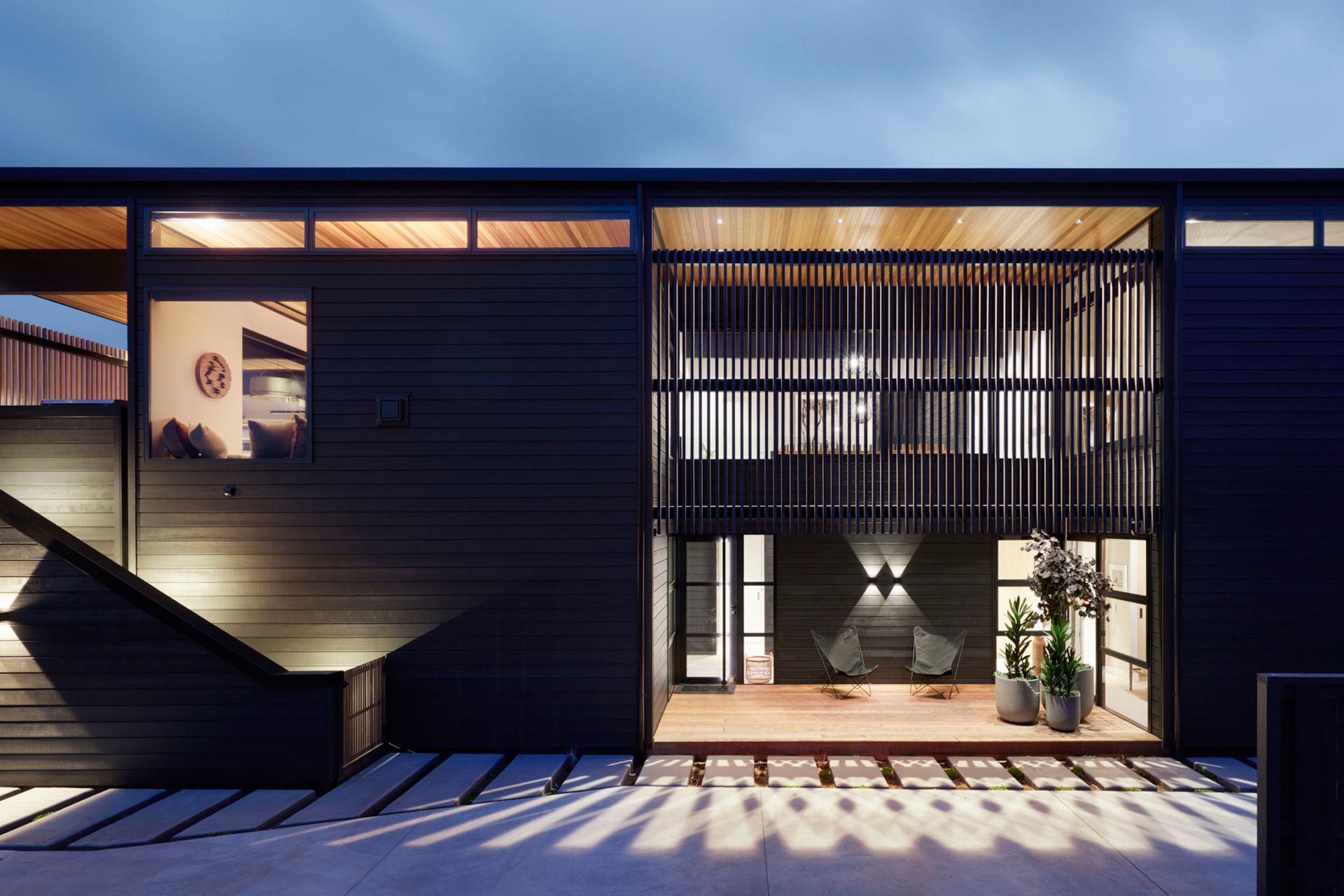“There is an underlying Kiwi fascination with the black bach,” says Brendon. He has created options for outdoor living for all weather conditions.