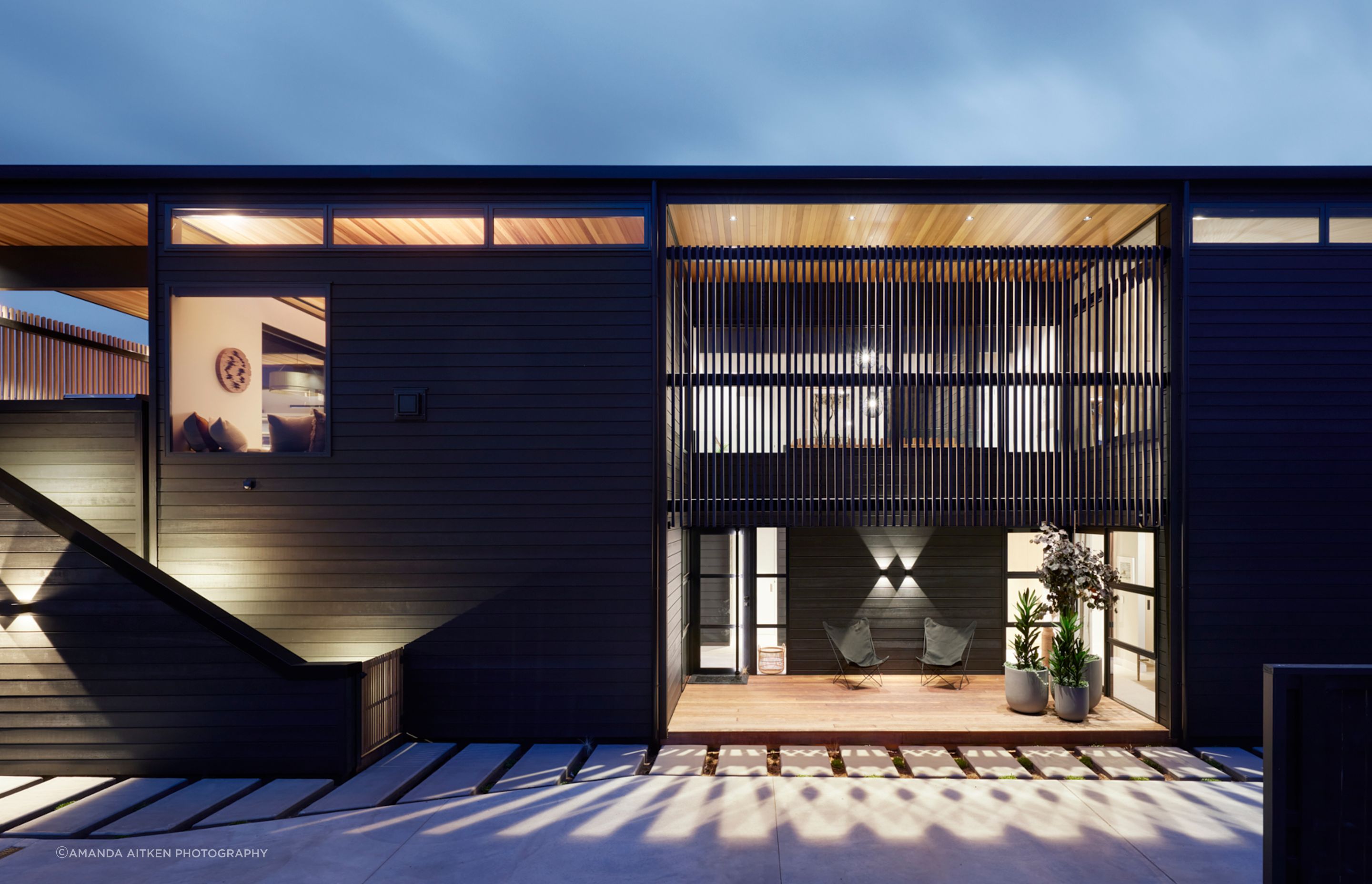 “There is an underlying Kiwi fascination with the black bach,” says Brendon. He has created options for outdoor living for all weather conditions.