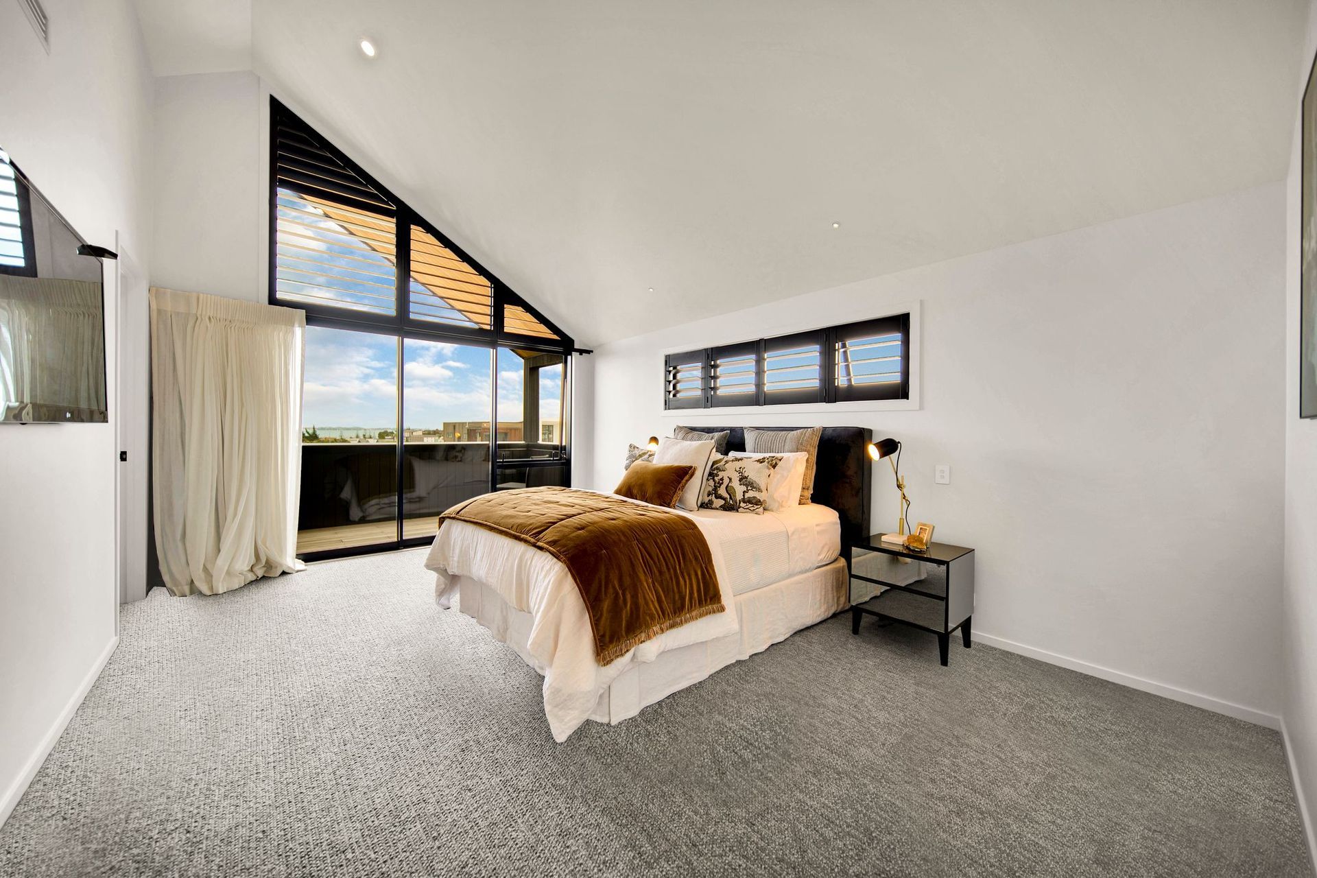 The pitched ceiling continues in the upstairs bedrooms.