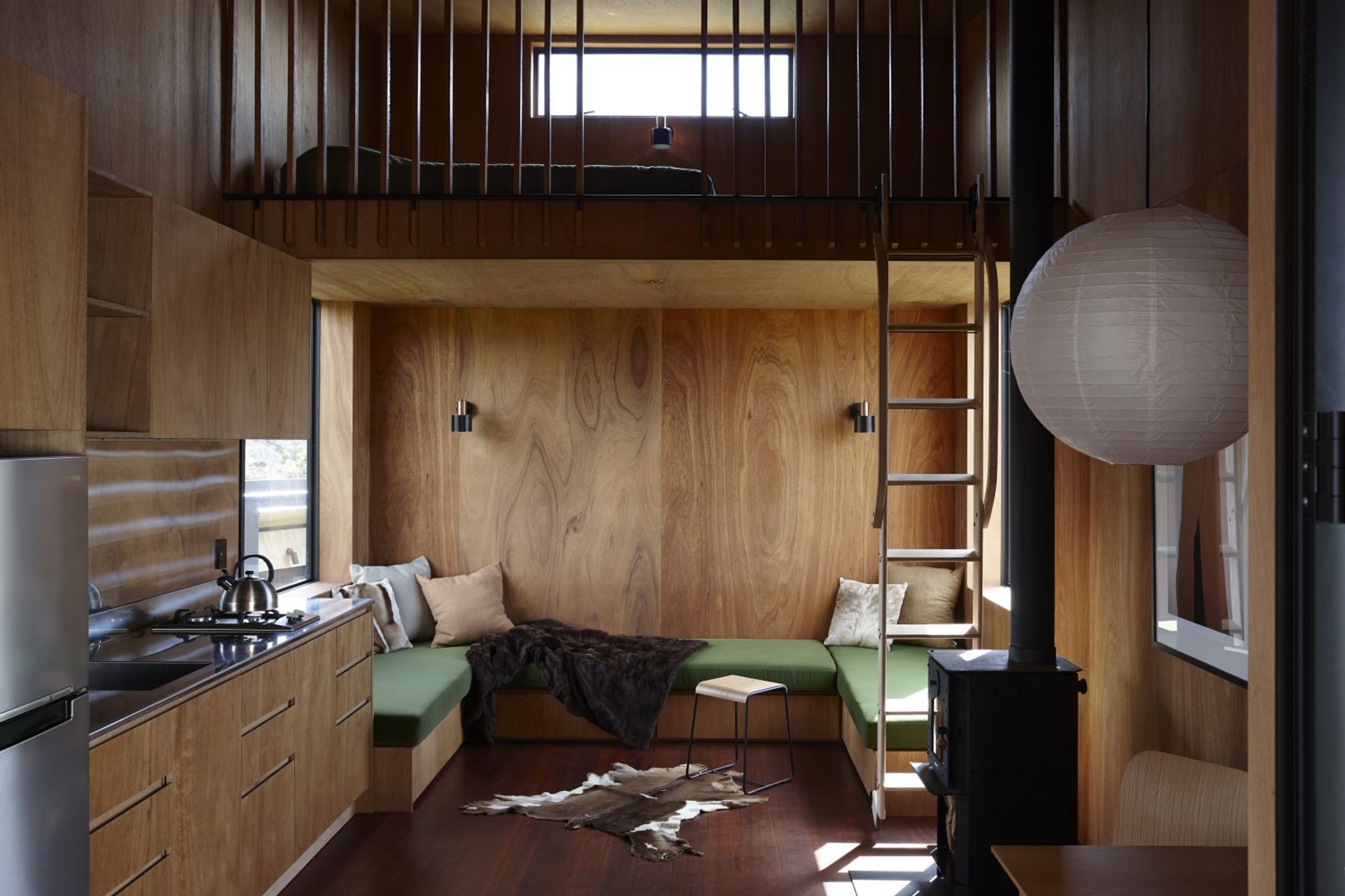 The main pod comprises a living, kitchen and dining space with a fireplace.