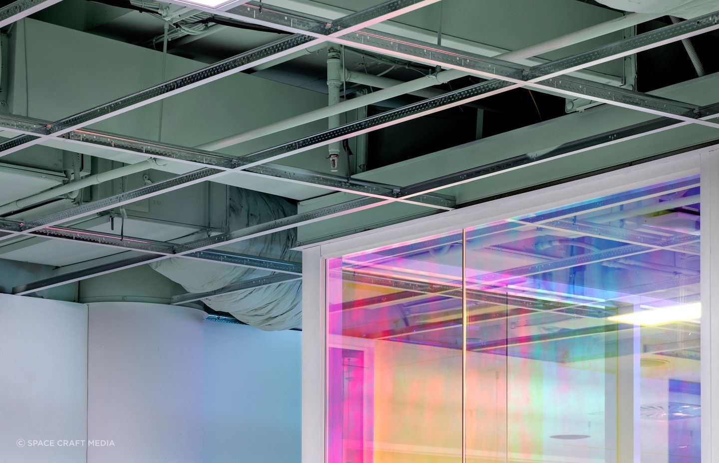 Exposed ceilings add to the edginess of the client's brand.