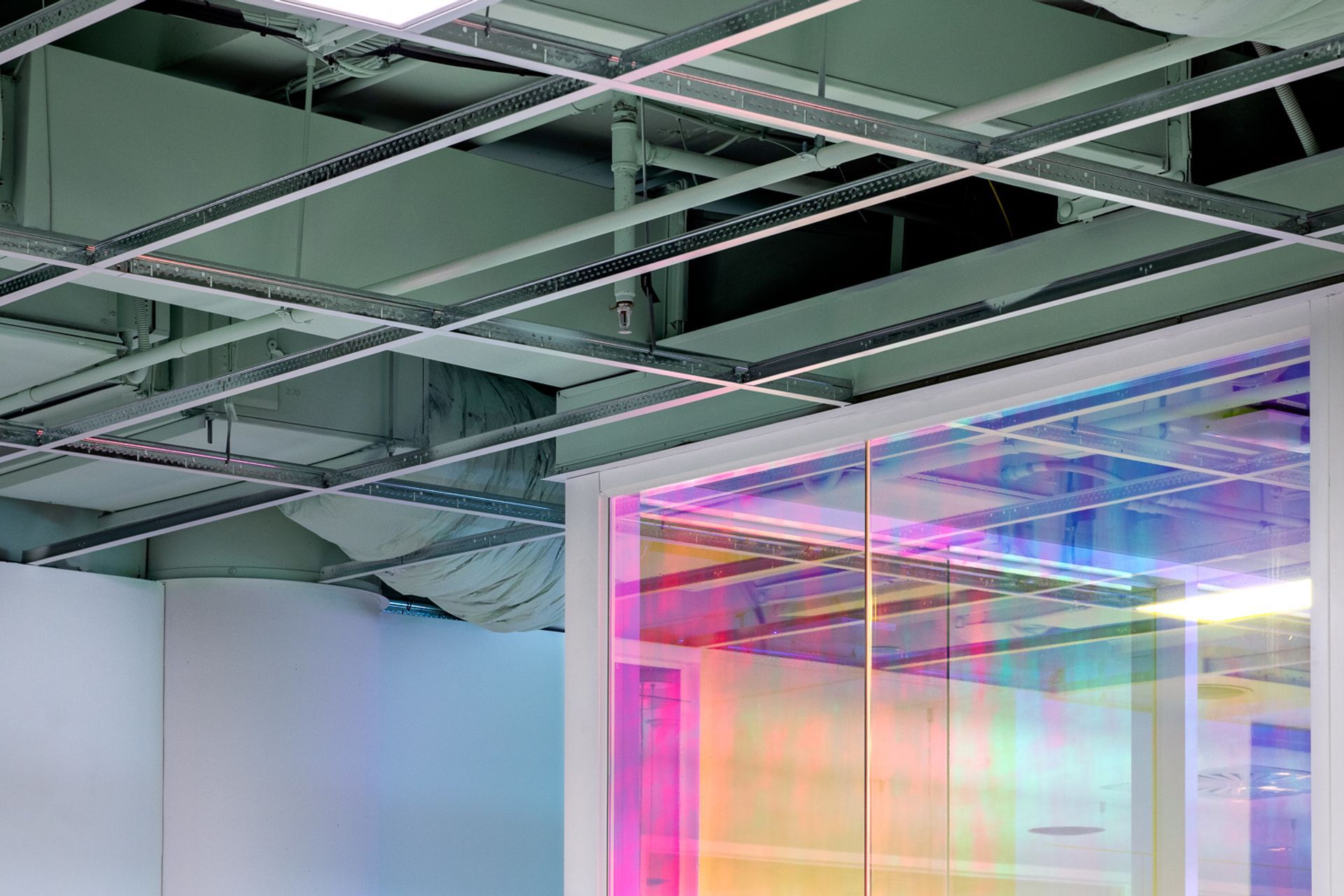 Exposed ceilings add to the edginess of the client's brand.