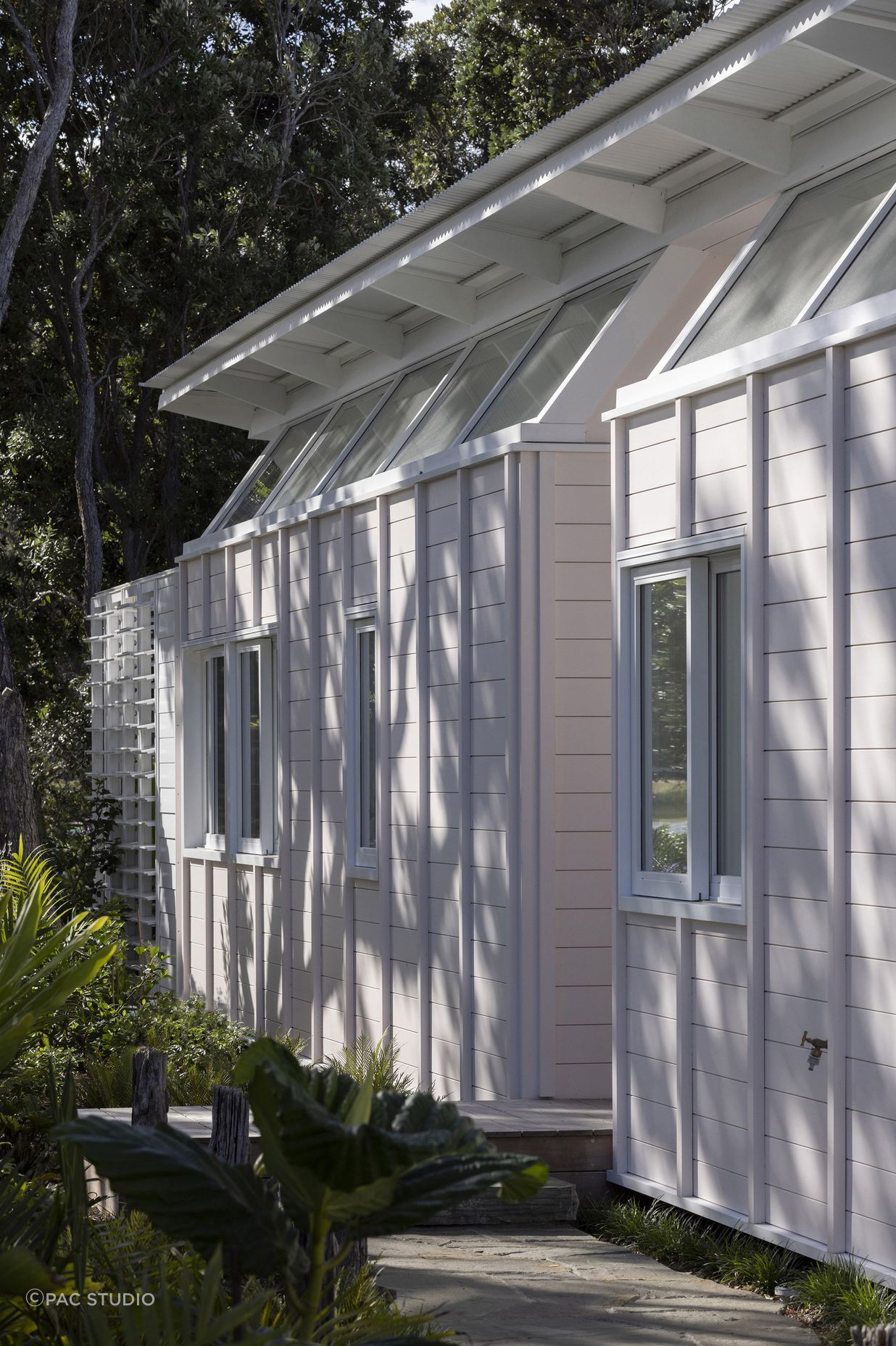 The home's exterior was painted a delicate sea shell pink, a nod to the seaside surroundings.