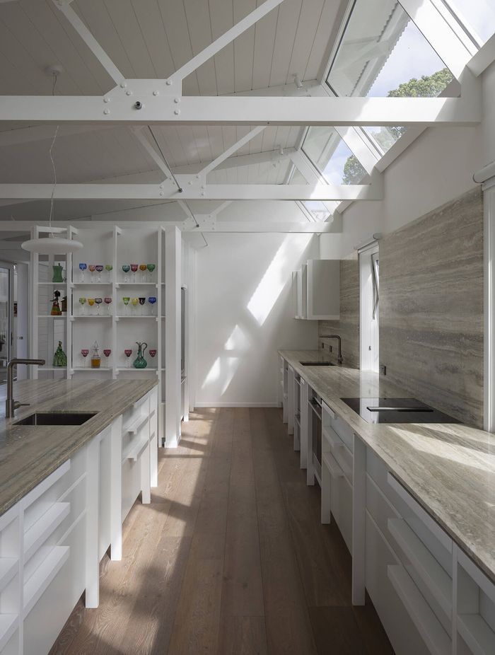 From sunrise to sunset, light is invited into the interior spaces, resulting in a warm, bright living environment.