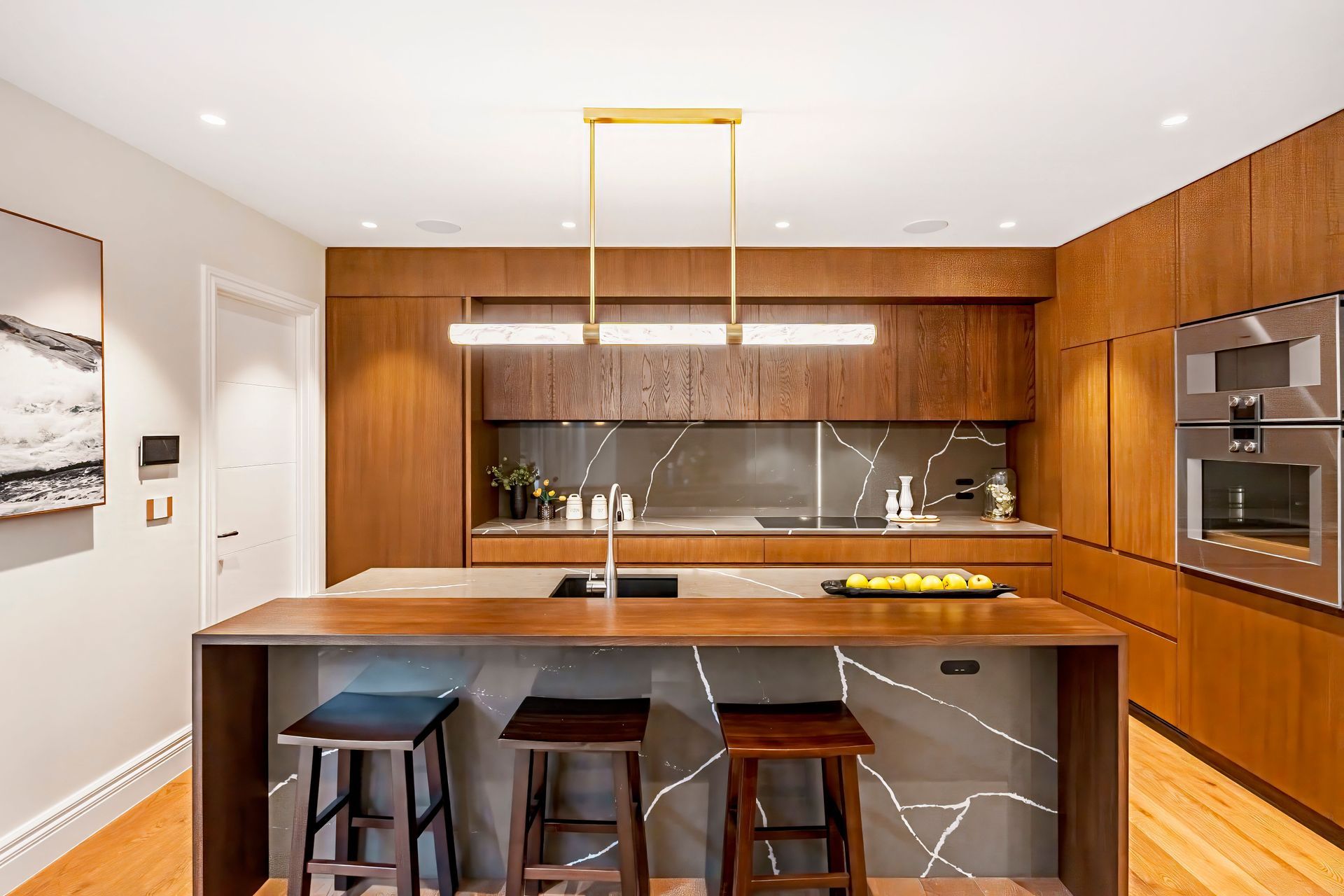 The full-height kitchen cabinet door on the left leads to the self-contained unit.