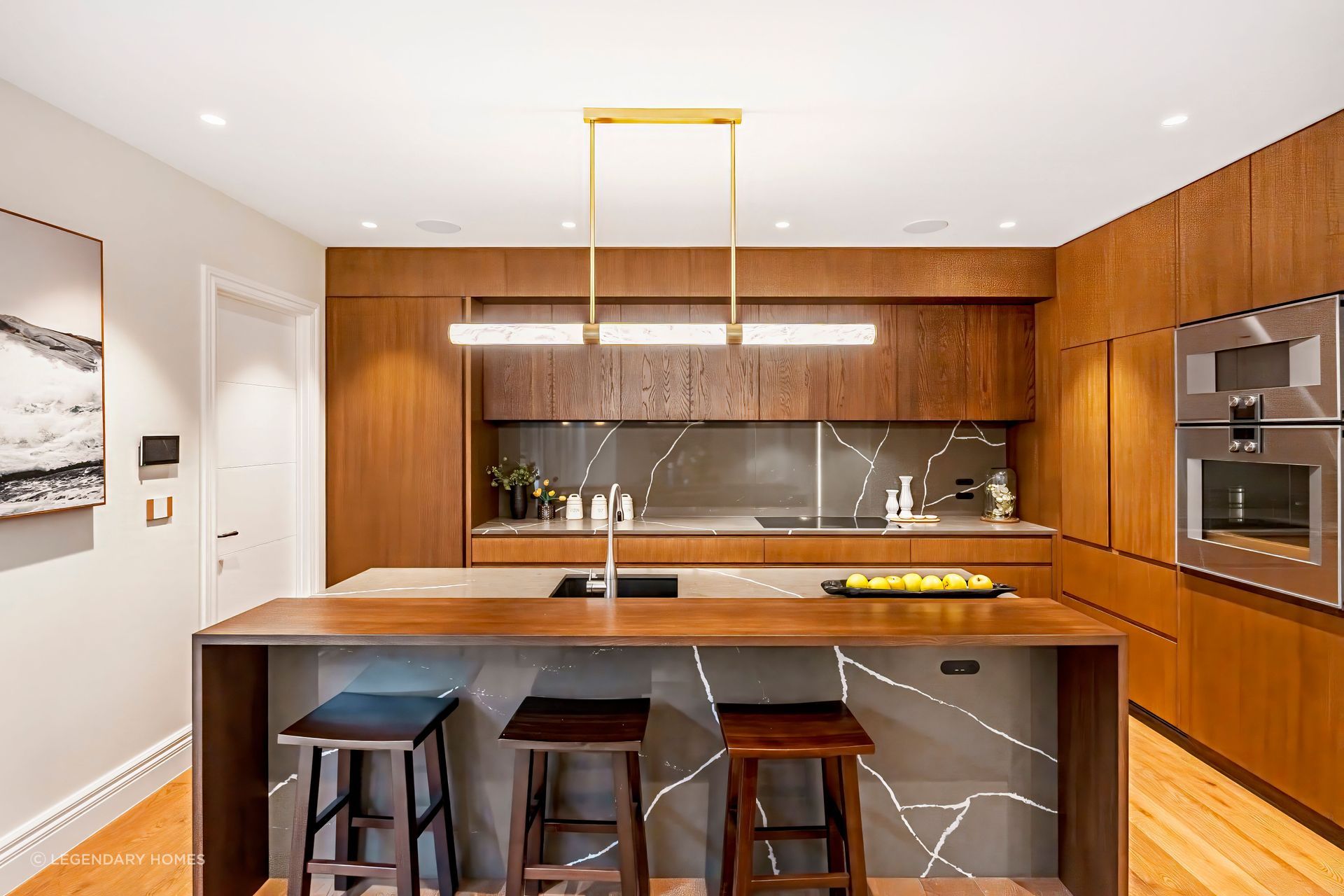 The full-height kitchen cabinet door on the left leads to the self-contained unit.