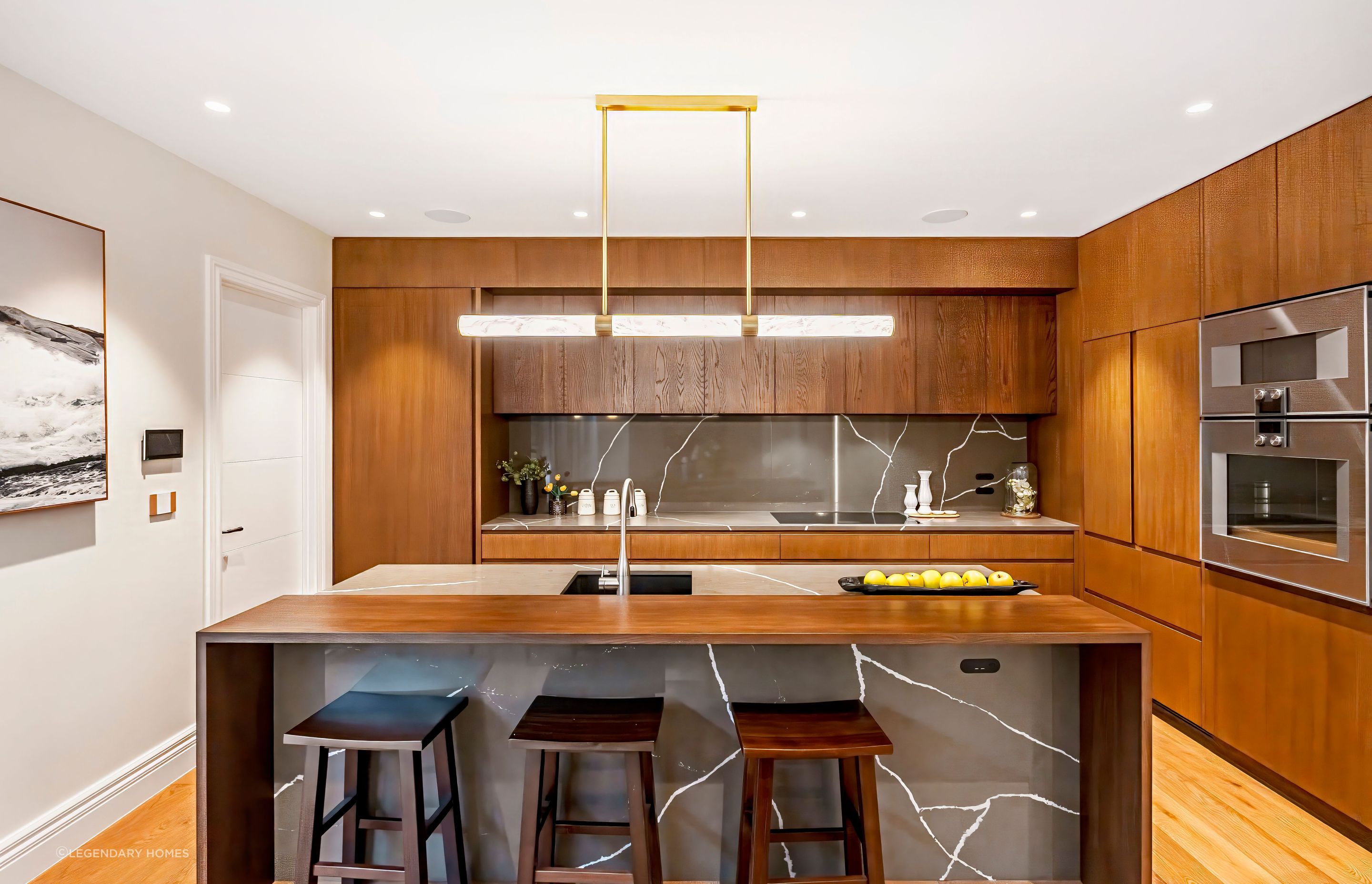 The full-height kitchen cabinet door on the left leads to the self-contained unit.