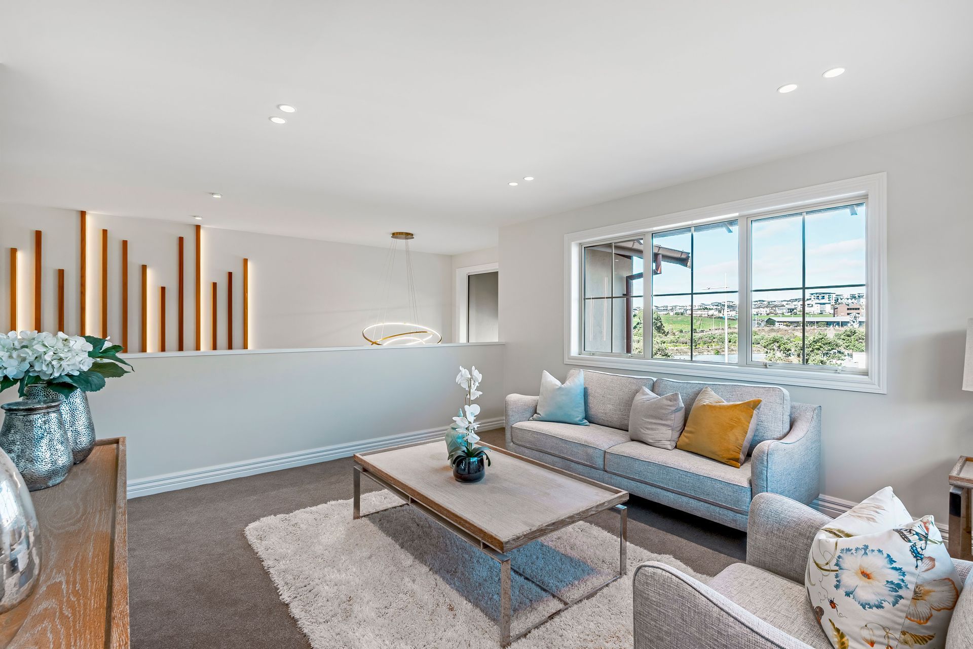 This second-storey living space offers versatility with the potential to be transformed into a media room.