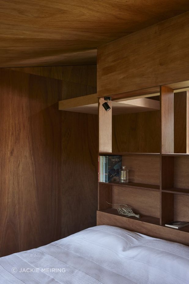The sleeping pod features built-in shelving.