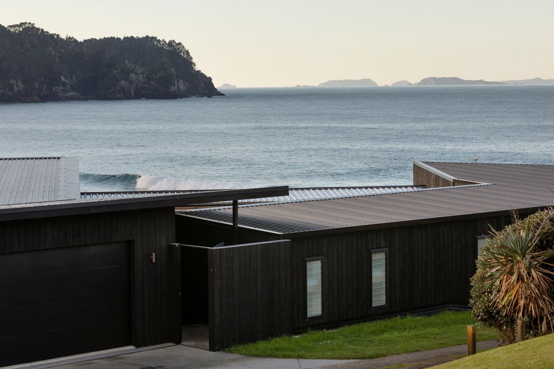 The new beach house at Hot Water Beach in Coromandel is a getaway for an extended family in Auckland, by Mike Dowsett and Lindley Naismith of Scarlet Architects.