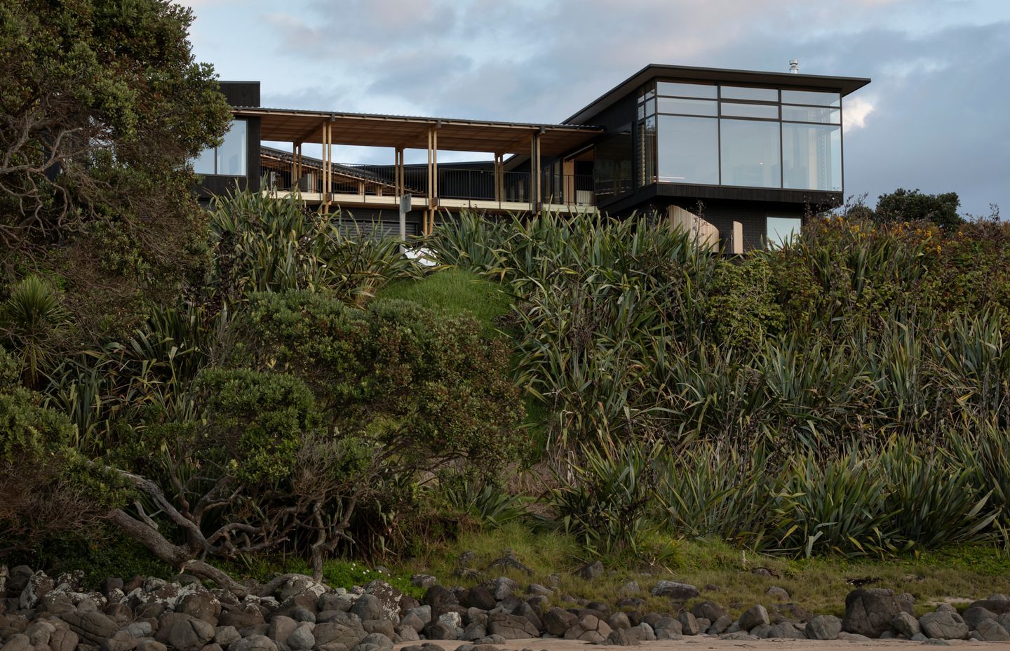 The house has five bedrooms, two bathrooms and two powder rooms. The build was by Hot Water Beach Design and Construction and uses mainly Accoya timber.