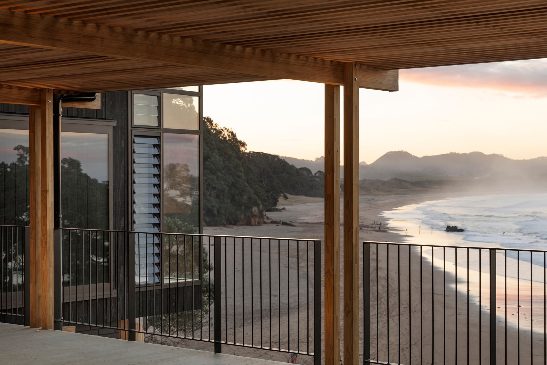 “It’s a fantastic view, looking all the way up Hot Water Beach,” says Lindley. “That's where people go and dig themselves a hole that fills with hot water. It’s a really popular beach, so a lot of the brief was around making a place that was private for the family.”