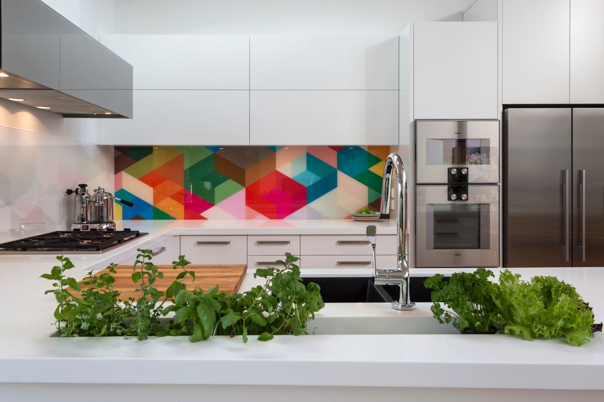 Geometric colour and adjacent geometric monochrome work harmoniously in this white kitchen.  Kitchen by Kitchen Architecture