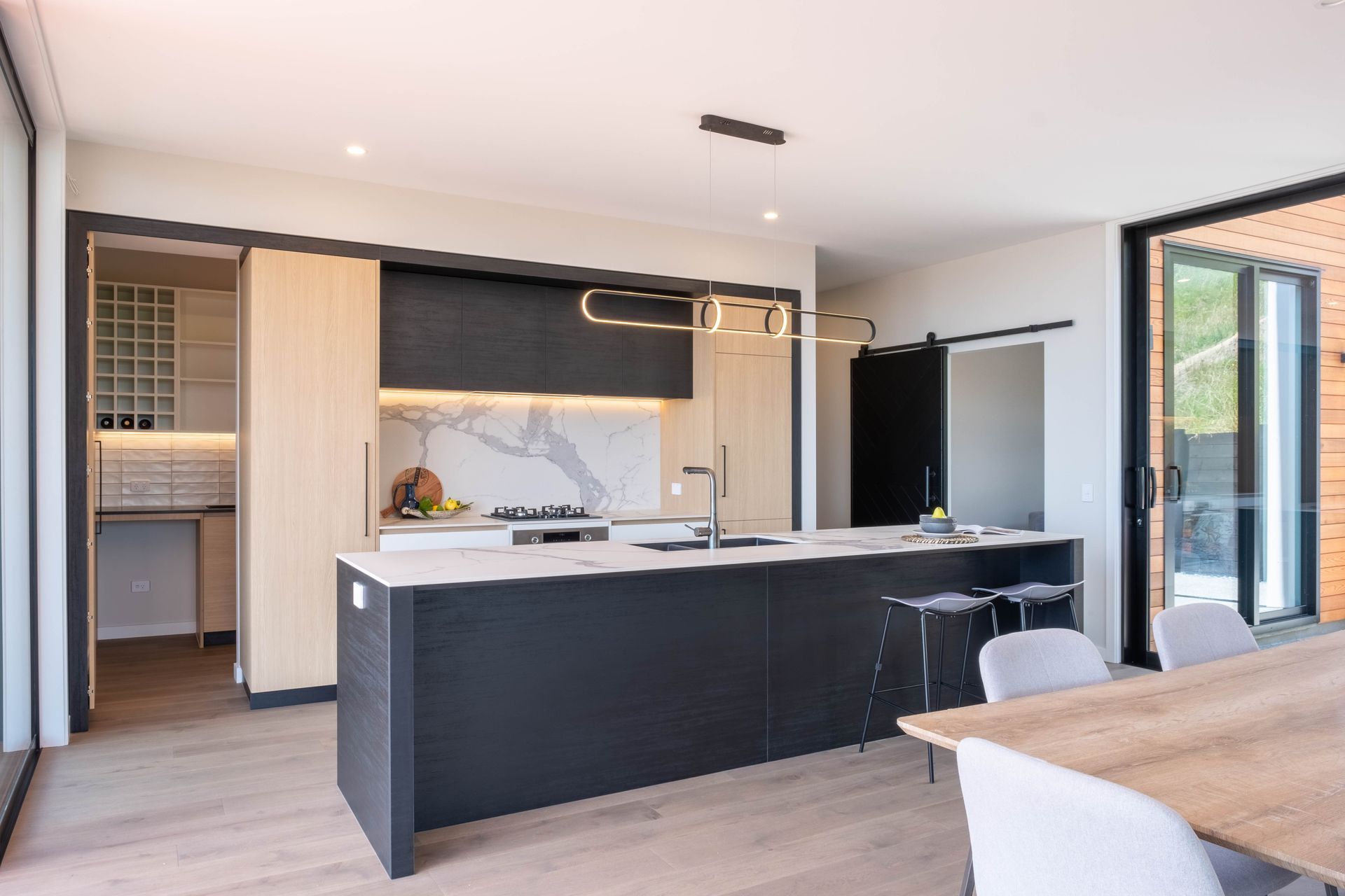 A scullery is hidden behind the kitchen.