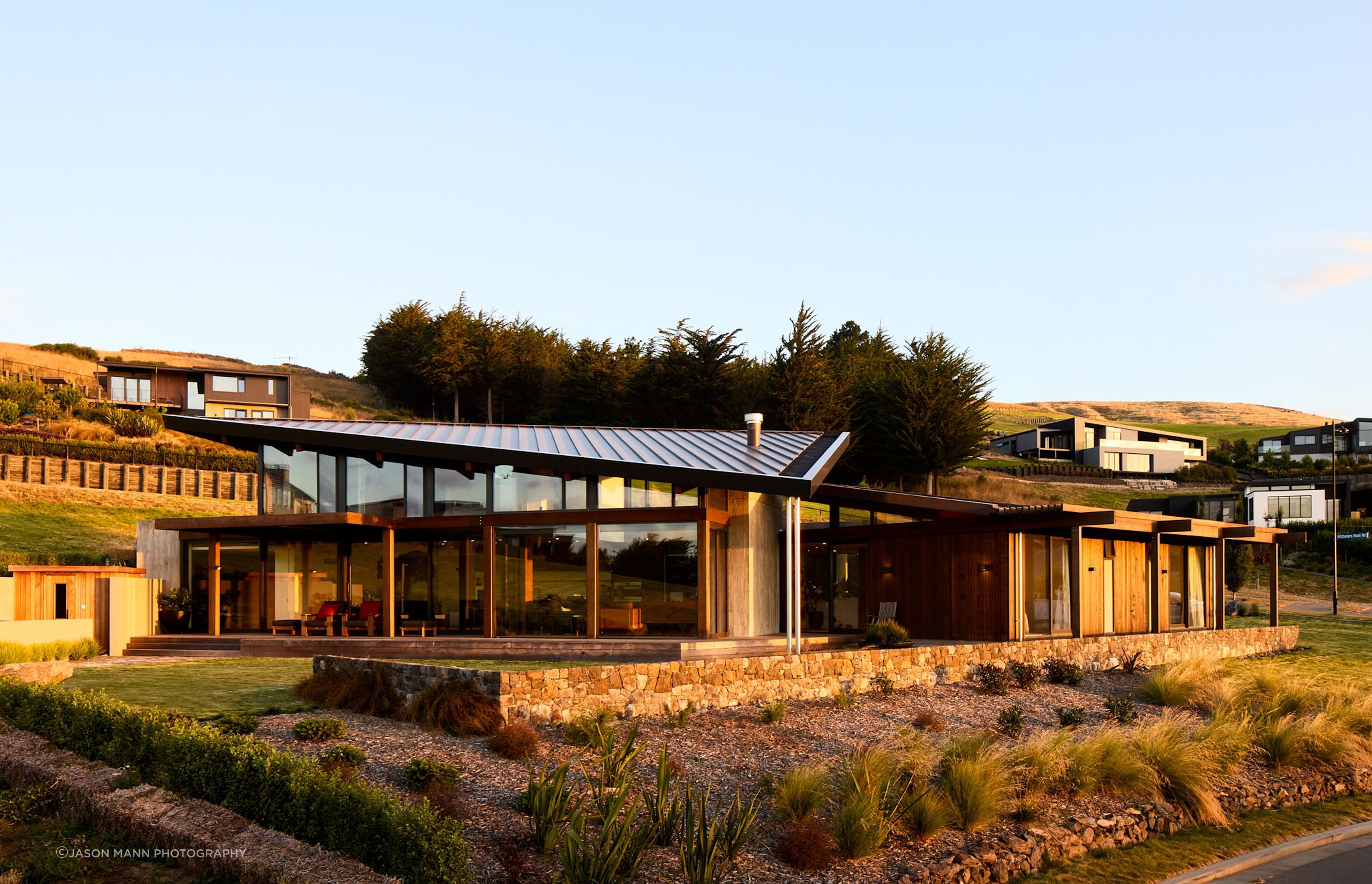 Swathes of glass connect the interior to the transitional space of the veranda, which follows through to the garden.