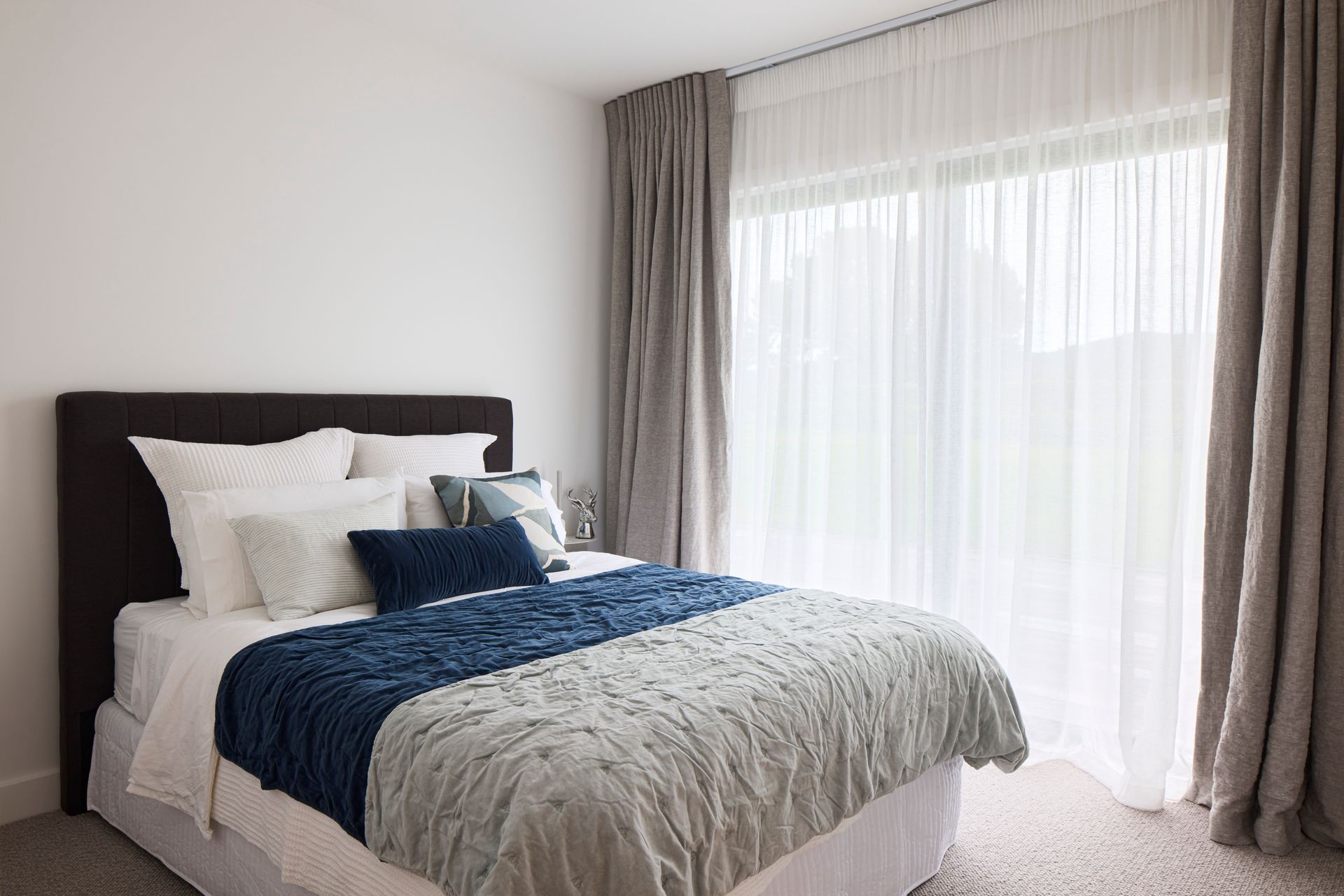 Located at one end of the home, the guest suite can be closed off to allow for privacy.