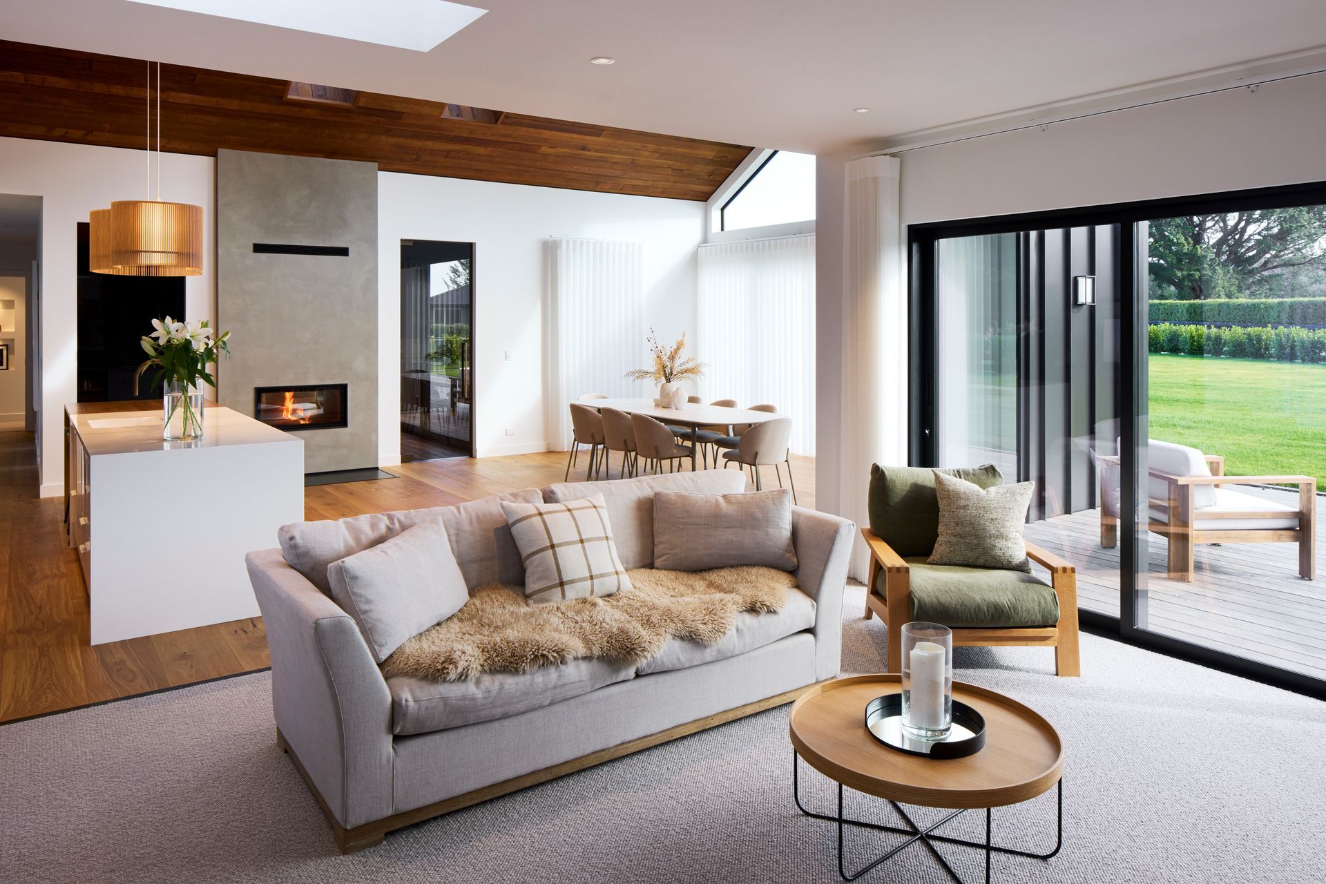 The living area is bright and welcoming, with a lower ceiling height to create a sense of comfort and warmth.