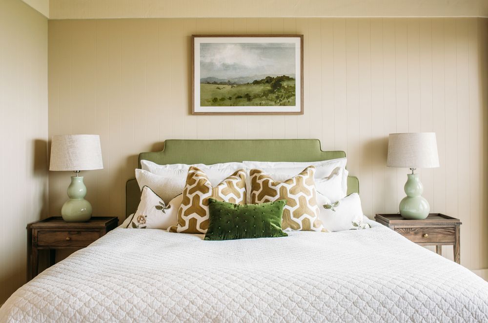 A bedroom in Foley Villa. The bedside lamps are by Eunice Taylor.